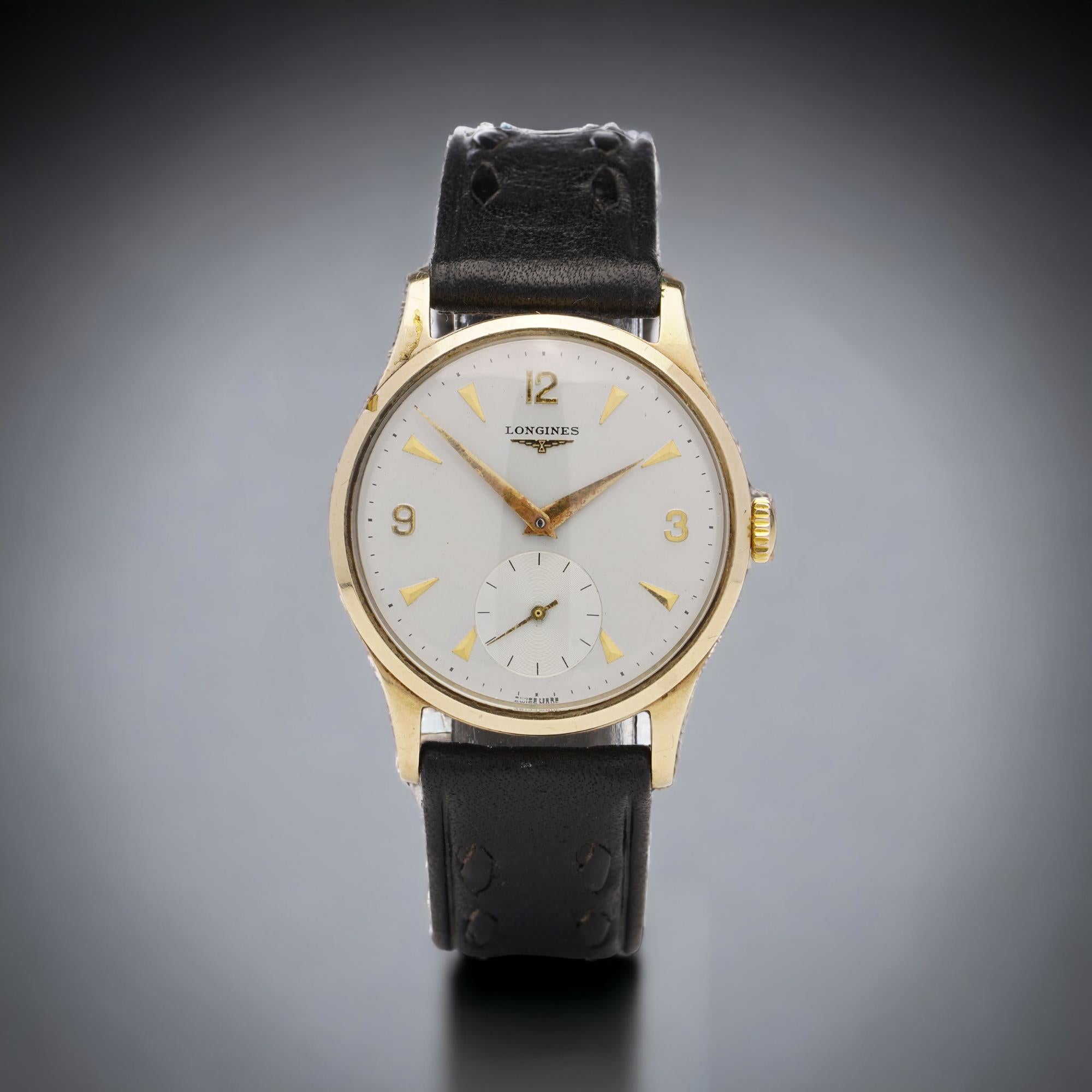 Longines 9kt. yellow gold men's manual winding wristwatch. 
Case was made in England, Birmingham, 1963

Year 1963
Reference Number: 503
Item Specifics:
Case Diameter (without crown): 33 mm
Case material: 9kt. gold. 
Bracelet material: leather