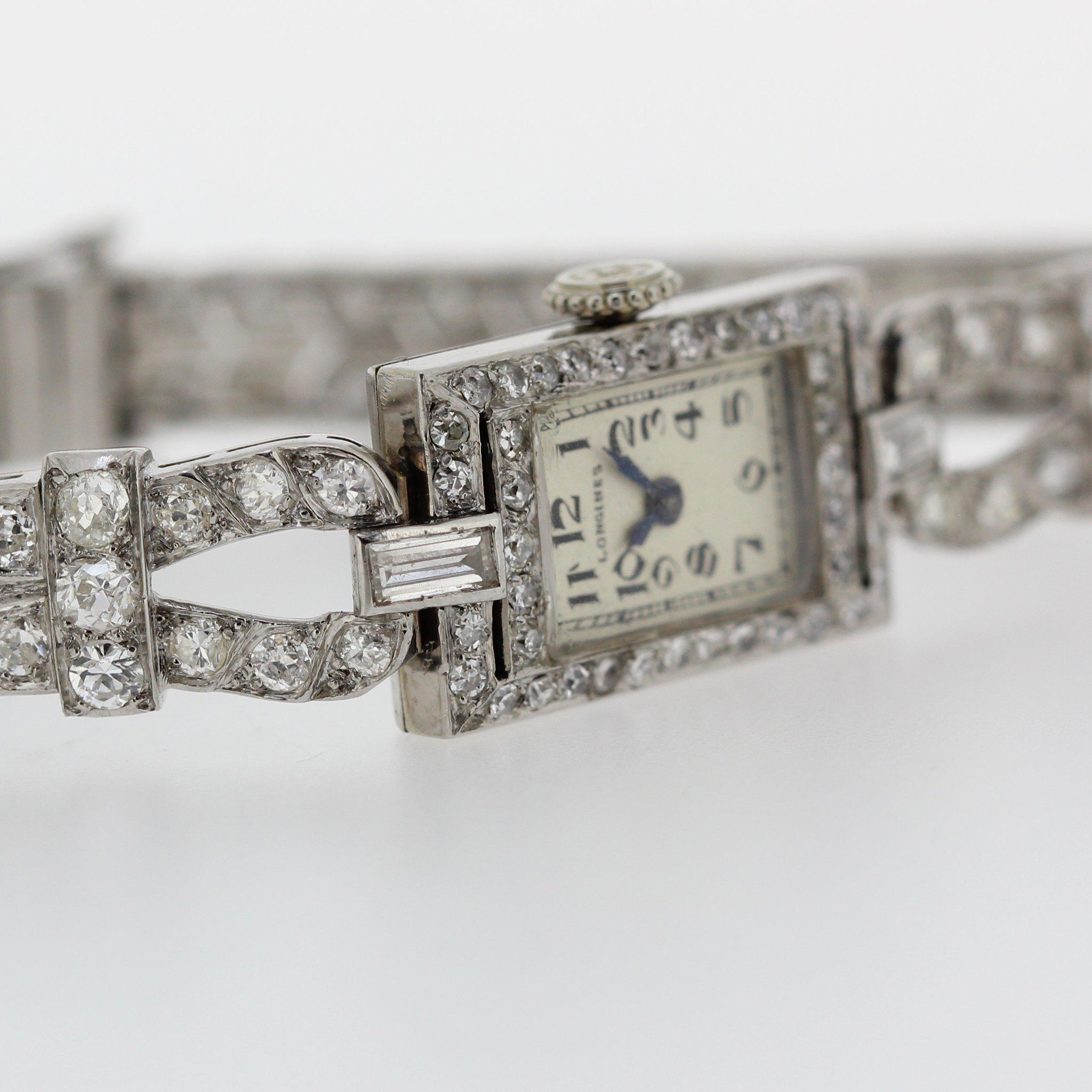 Introduction:
This Longines Art Deco Platinum and diamond ladies watch, circa 1930-1940, features a  rectangular shaped baguette case, pave set with 136 diamonds to total approximately 6.5 carats. Case and movement stamped with 4663851. 

About Us: