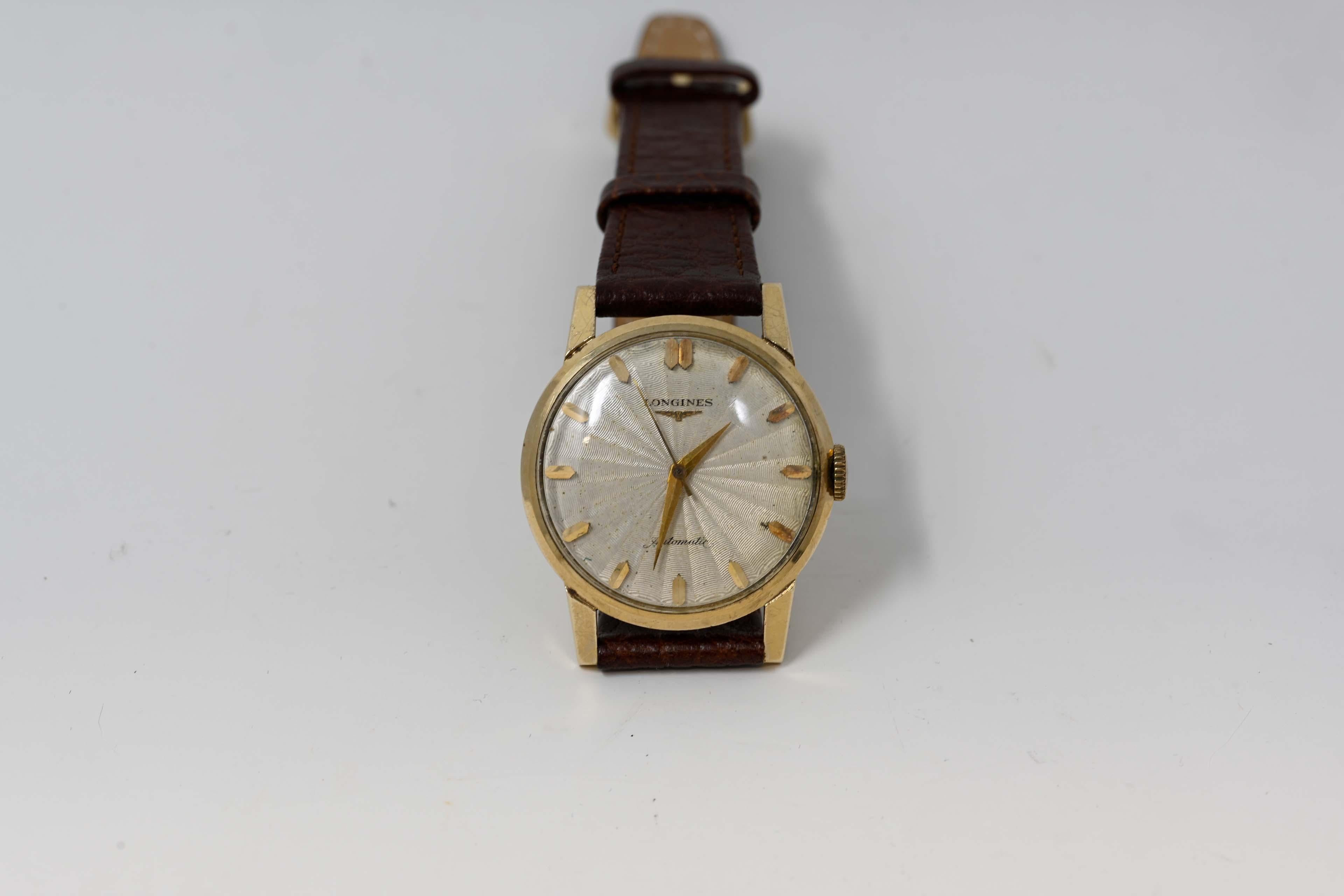 Longines Automatic 14k Yellow gold men's watch in working order. The gold mark is on the back, the case is a size 33mm. Swiss made, circa 1970. In working order and in good condition.