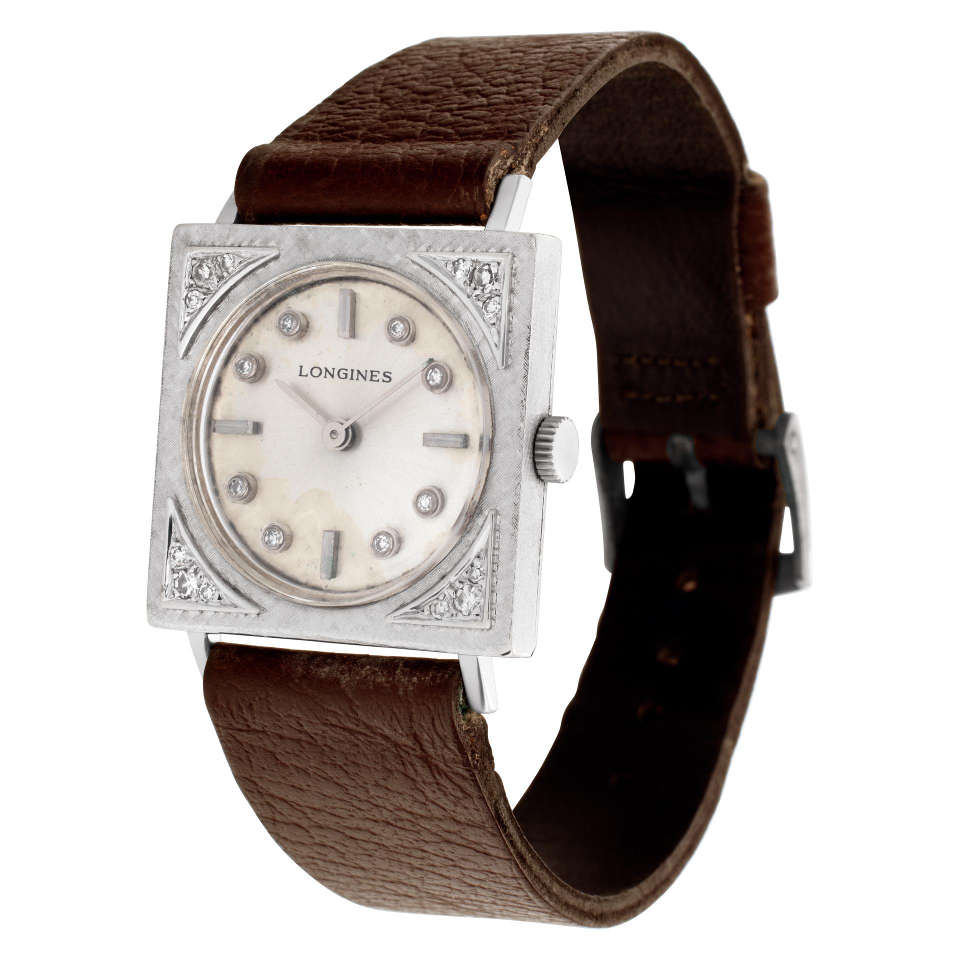 Longines Vintage Classic in 14k white gold on tan leather strap. Manual. 25 mm case size. Fine Pre-owned Longines Watch. Certified preowned Vintage Longines Classic watch is made out of white gold on a Brown Leather strap. This Longines watch has a