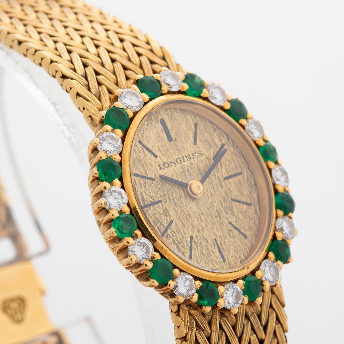 Women's Longines Cocktail Watch, 18K Yellow Gold, 12 x Emeralds / Diamonds. Circa 1964. For Sale