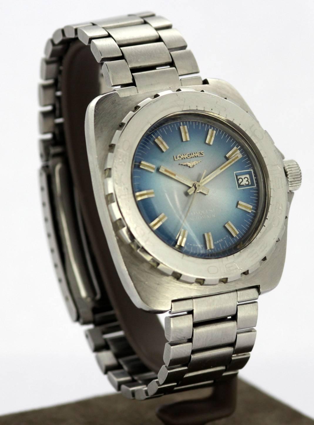 Longines Conquest - Automatic Wristwatch 
Circa.1970's 

Gender:	Men's 
Case size (including crown): 45 x 45 mm 
Movement: Automatic 
Watchband Material: Stainless Steel (Original Longines) 
Case material : Steel 
Display Type:	Analogue	
Dial: Blue