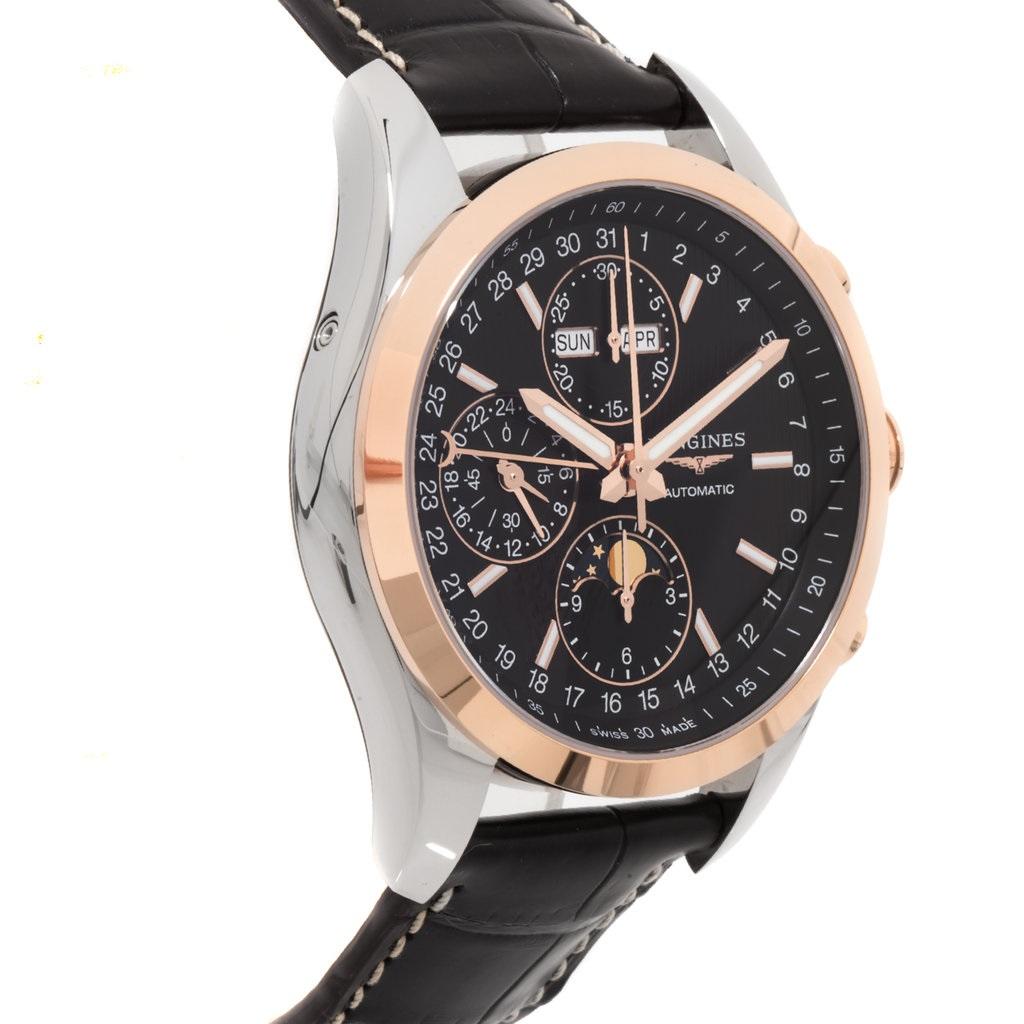 Stainless steel case with a black alligator leather strap. Fixed rose gold PVD bezel. Black dial with luminous hands and index hour markers. Date scale/minute markers appear around the outer rim. Dial Type: Analog. Complete calendar. Chronograph -