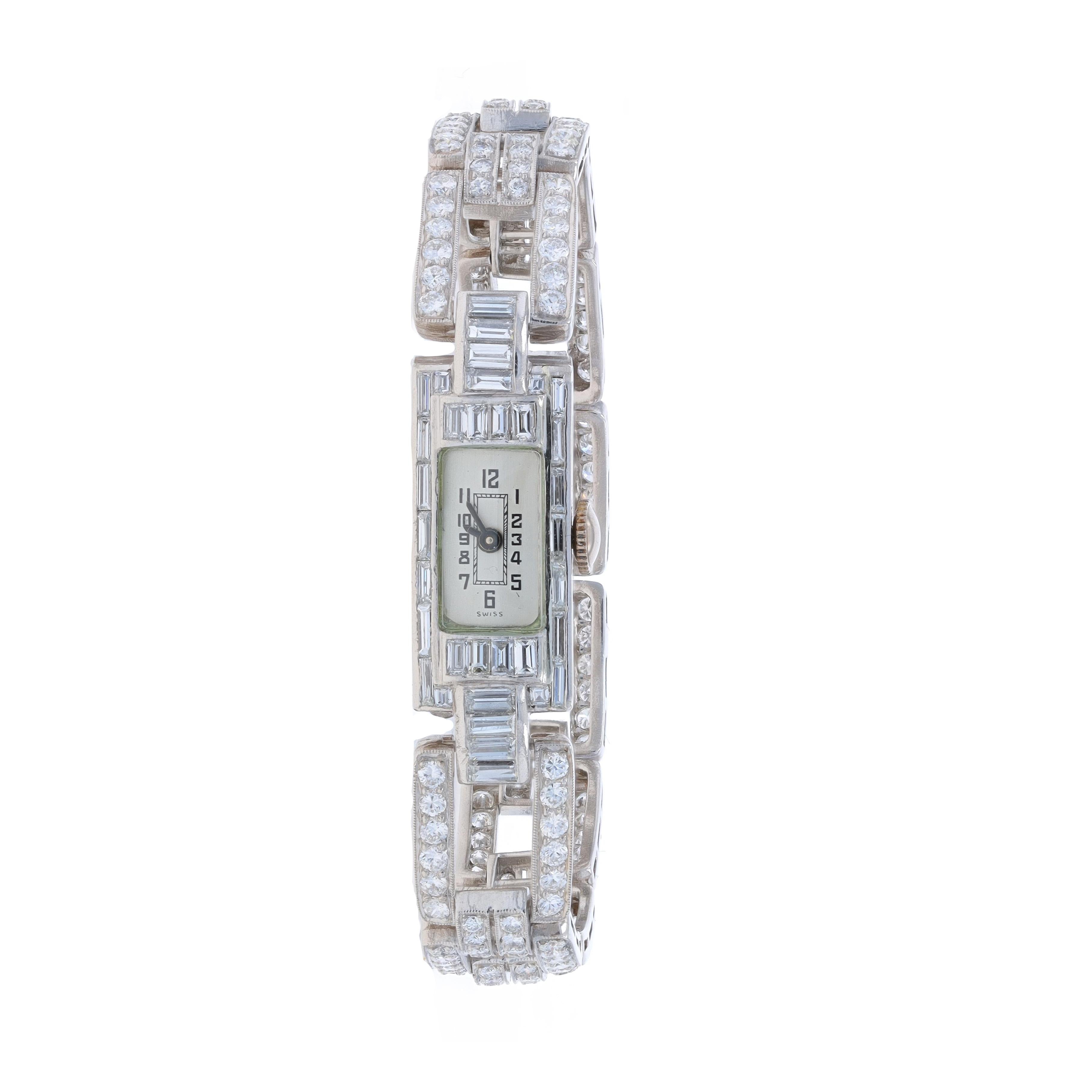 Brand: Longines
Number of Jewels: 17
Warranty: One Year
Era: Vintage
Date: 1950s - 1960s
Movement Maker: Swiss
Dial Color: Silver

Metal Content: Platinum

Stone Information
Natural Diamonds
Carat(s): 5.20ctw
Cut: Round Brilliant
Color: F -