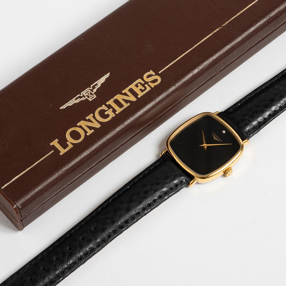 Our very attractive Longines vintage dress watch features a manually wound movement with gold capped case (32mm inc crown by 35mm lug to lug) , stainless steel case back, black gloss dial with single diamond at 12. A classically proportioned dress