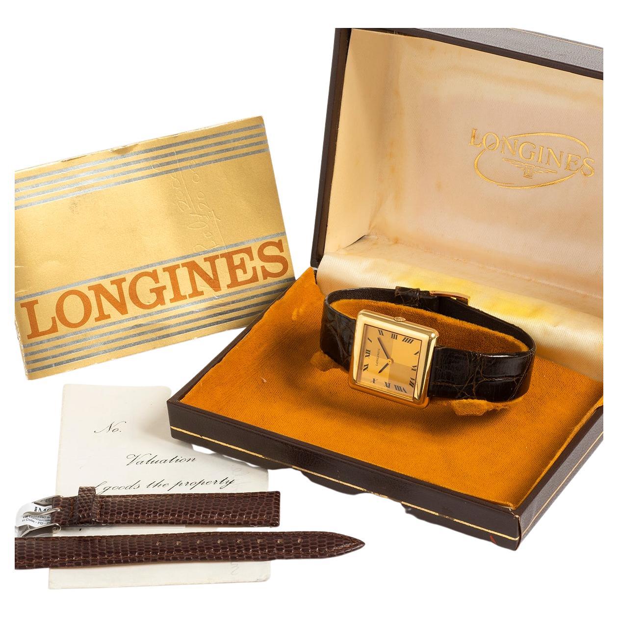 Our extremely rare vintage Longines features an 18k yellow gold case of 29mm x 30mm , chequer board dial and leather strap with gold tone buckle. Included with this example comes its original box, original open / blank papers as well as a valuation