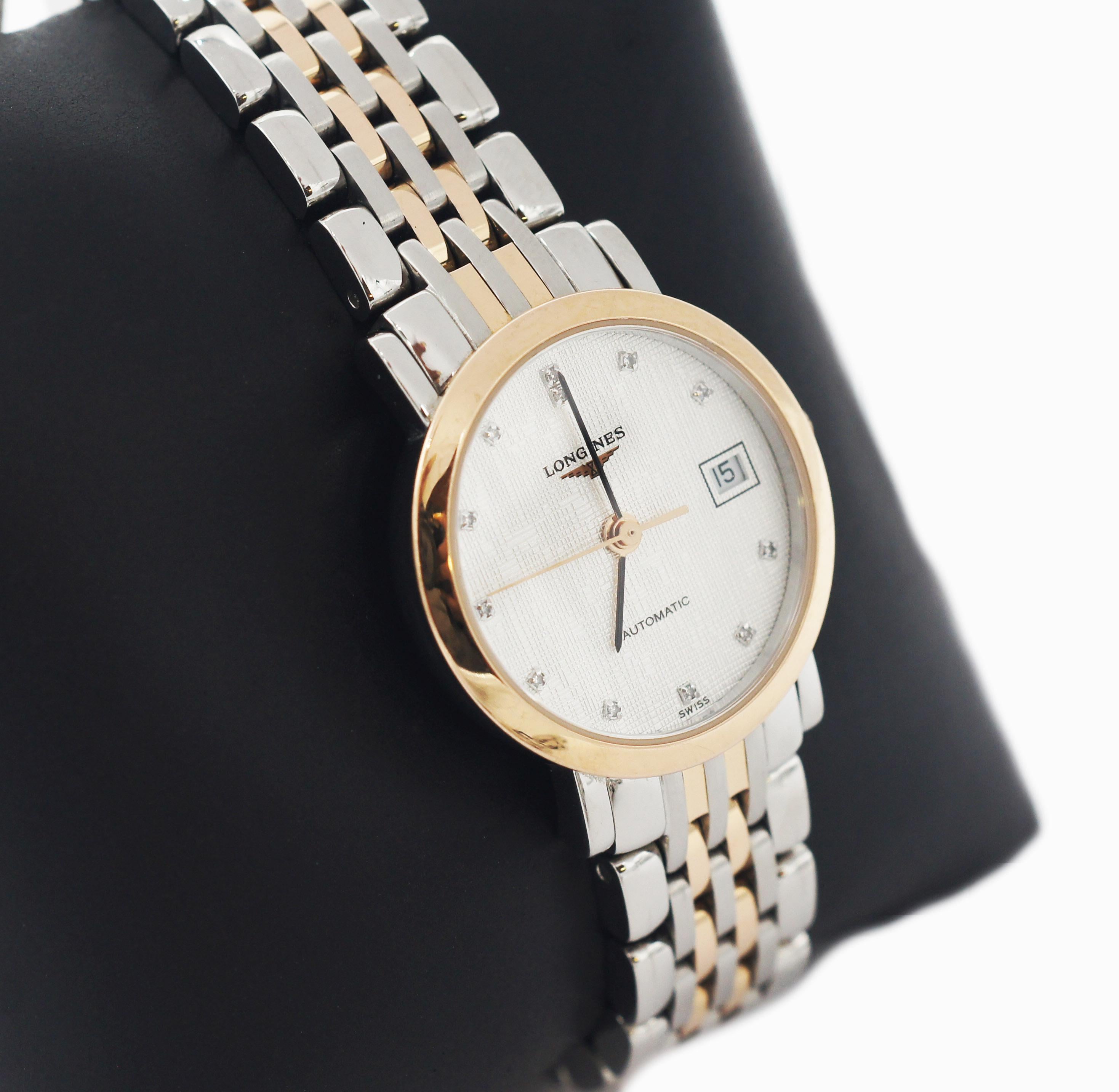 Longines 
Elegant Collection'S 
Modell L4.309.5.77.7. 
Edelstahl & 18K Rose Gold Gehäuse mit Stahl & Rose Gold Tone Uhrenarmband. 
Stahl & 18K Rose Gold Lünette. 
Zifferblatt in strukturiertem Silber mit Diamanten Markierungen zusammen mit schwarzen