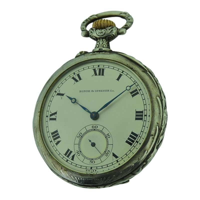 FACTORY / HOUSE: Longines / Bunde & Upmeyer
STYLE / REFERENCE: Open Faced Pocket Watch 
METAL / MATERIAL: Sterling Silver
CIRCA / YEAR: 1909
DIMENSIONS / SIZE: 40mm
MOVEMENT / CALIBER: Manual Winding / 15 Jewels 
DIAL / HANDS: Original Silvered with