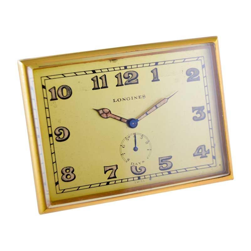 FACTORY / HOUSE: Longines Watch Company
STYLE / REFERENCE: Art Deco Desk Clock 
METAL / MATERIAL: Gilded Brass
CIRCA / YEAR: 1930's
DIMENSIONS / SIZE:  3 1/2 X 2 1/2
MOVEMENT / CALIBER: Manual Winding / 17 Jewels / Power Reserve High Grade
DIAL /