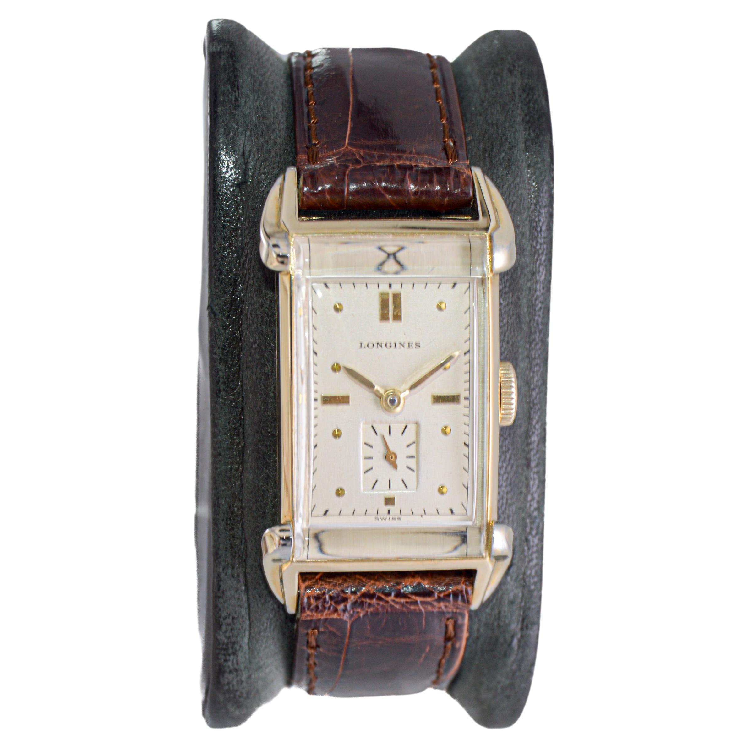 FACTORY / HOUSE: Longines Watch Company
STYLE / REFERENCE: Art Deco / Tank Style 
METAL / MATERIAL: Yellow Gold Filled
CIRCA / YEAR: 1940's
DIMENSIONS / SIZE: Length 23mm x Width 41mm
MOVEMENT / CALIBER: Manual Winding / 17 Jewels / Caliber 9L
DIAL