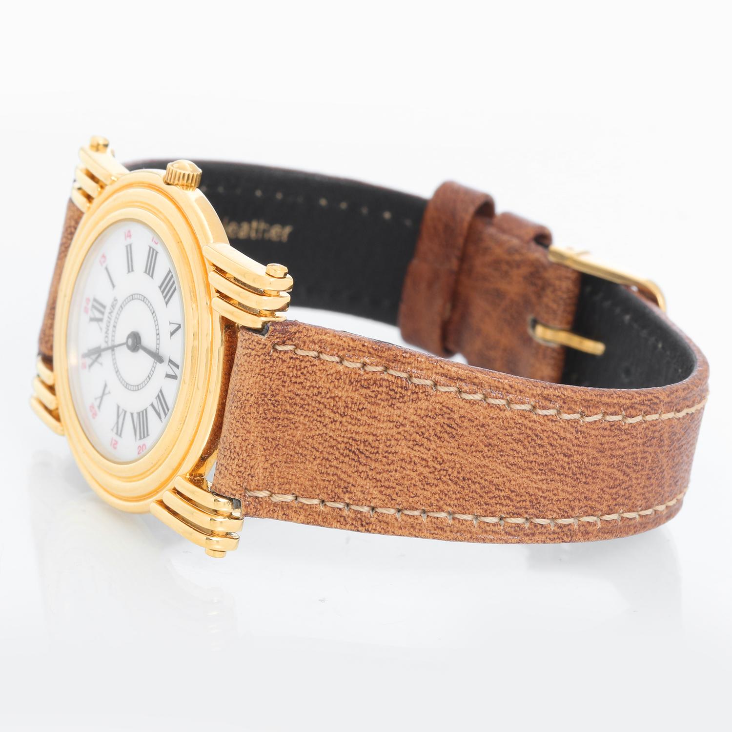 Longines Gold Plated Quartz Watch - Quartz. Gold plated ( 32 x 38 mm ). White dial with Roman numerals. Longines brown leather band. Pre-owned with Longines box. 