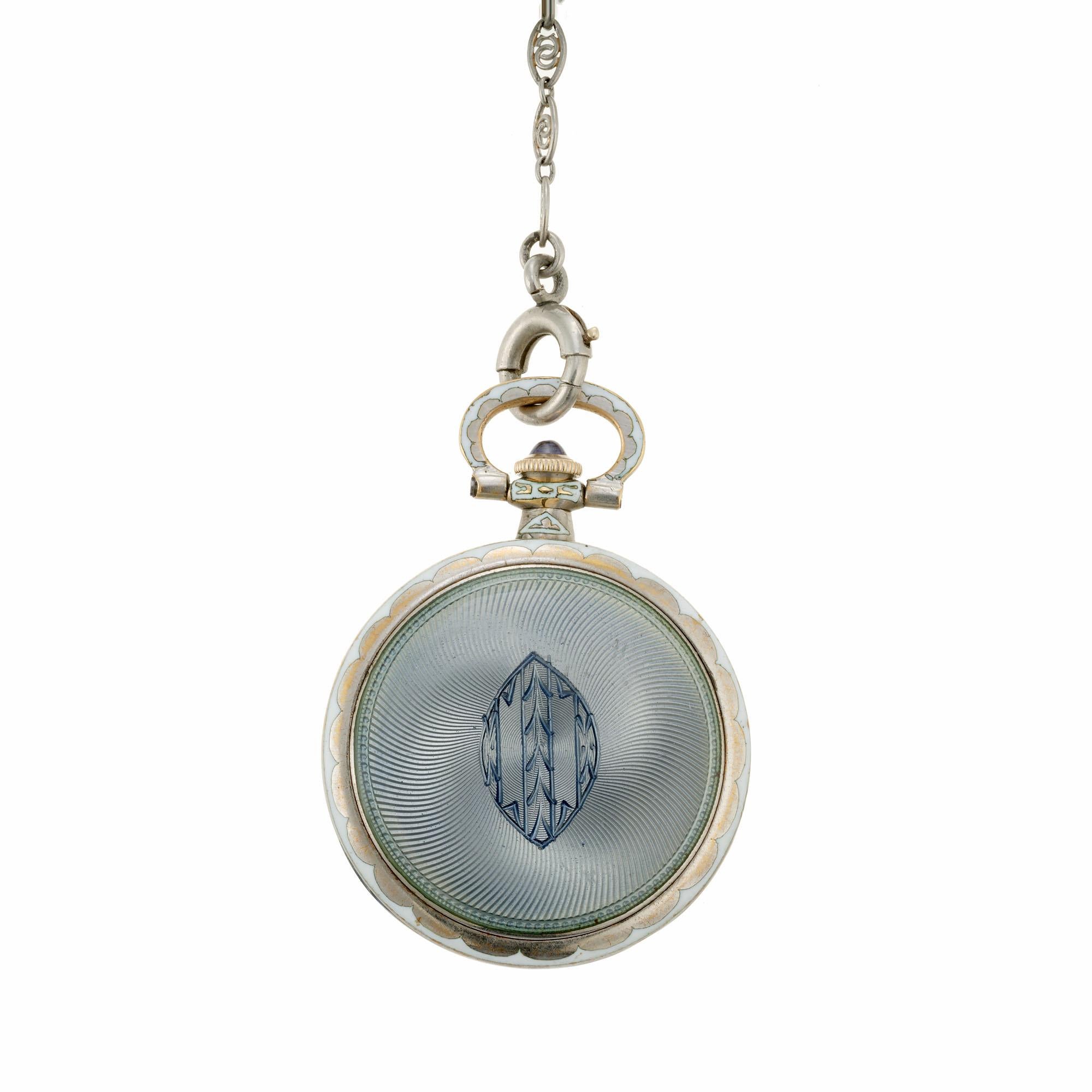 Longines enamel pendant watch. Gray blue and white enamel and gold face, with a matching 22 inch chain. Circa 1912. 

14k white gold
21.9 grams
Tested: 14k
14k white gold
Length: 22 Inches
Dangle: 2.5 inches
Watch: 1.25 inches
Width: 2.03mm
Depth: