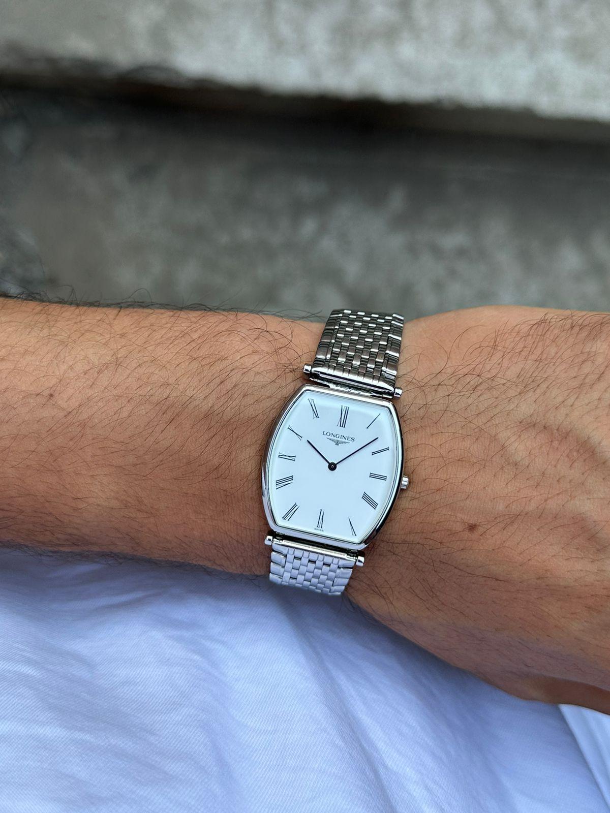 Brand: Longines

Model: La Grande Classique

Reference Number: L47054

Country Of Manufacture: Switzerland

Movement: Quartz

Case Material: Stainless steel

Measurements : 29 mm x38.5 mm (without crown)

Band Type : Stainless steel

Band Condition