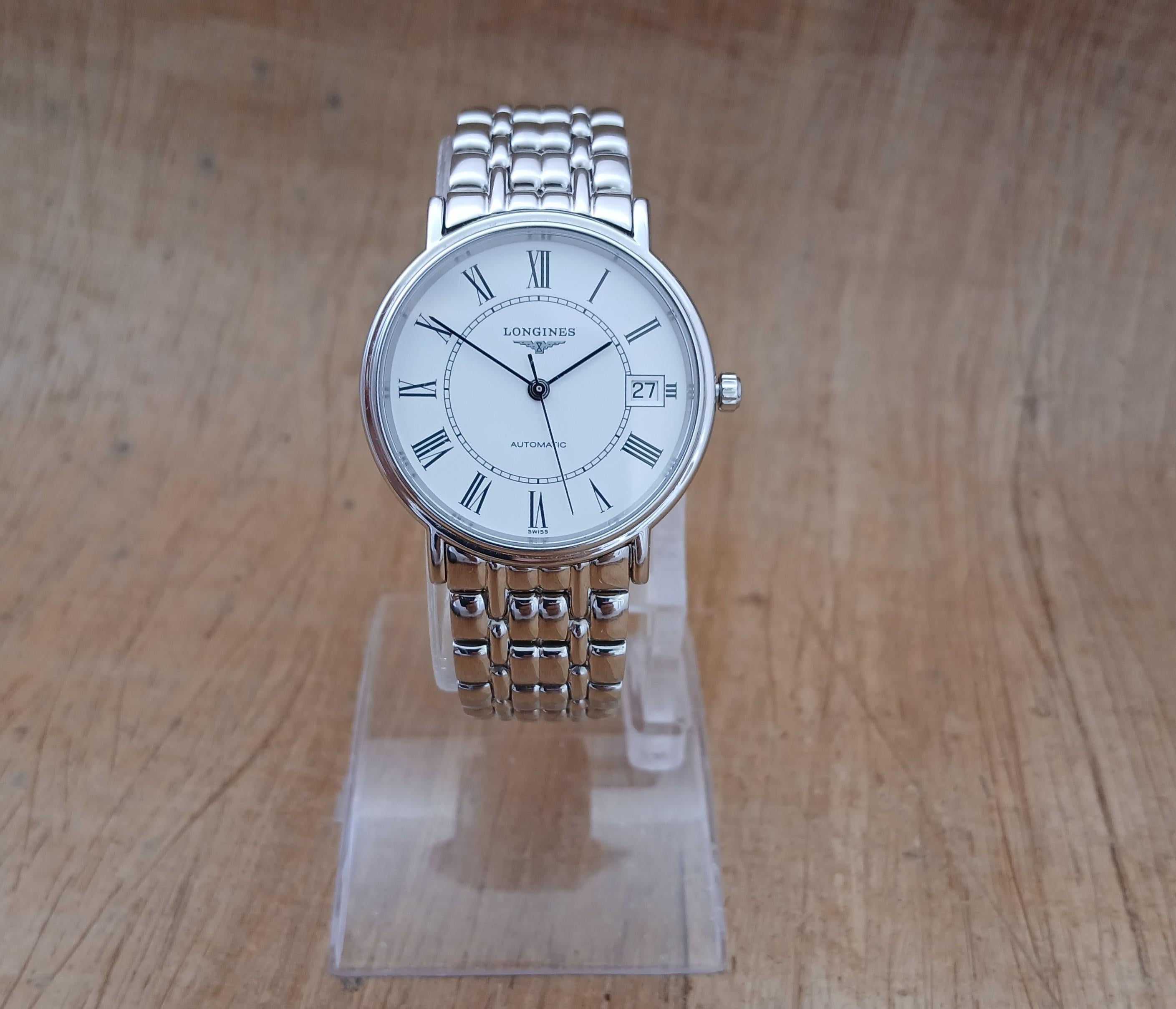 Marchio: Longines

Model: La Grande Classique Presence

Numero di riferimento: L4.721.4

Paese di produzione: Svizzera

Movimento: Automatico

Materiale della cassa: Acciaio inossidabile

Misure: Larghezza della cassa: 34 mm. (senza corona)

Tipo di