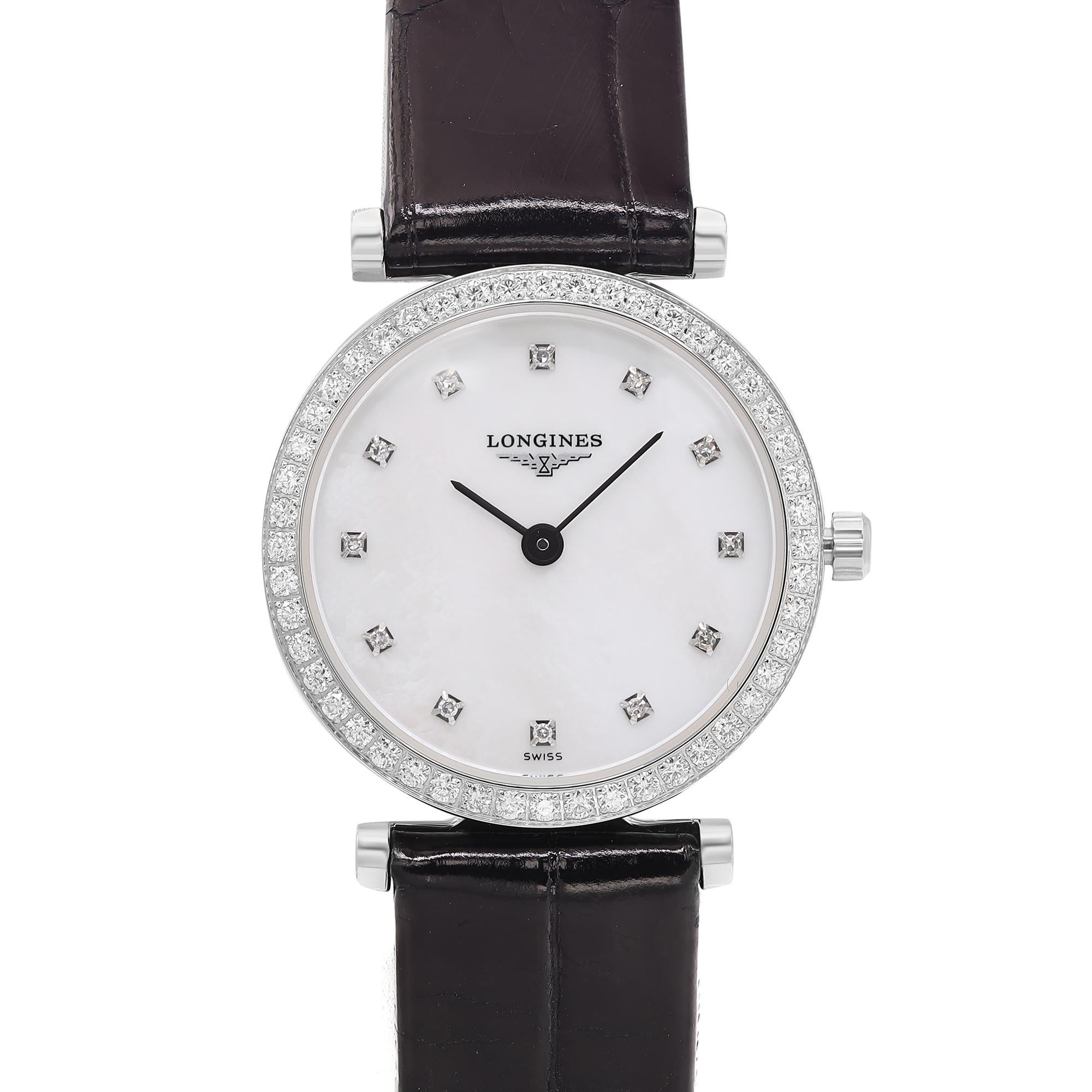 This Longines la Grande Classique lady's watch has never been worn or used and only has tiny wrinkles on the band due to displaying in the store. The dial and bezel have 60 diamonds set at 0.437ct total. Comes with an original box and paper.