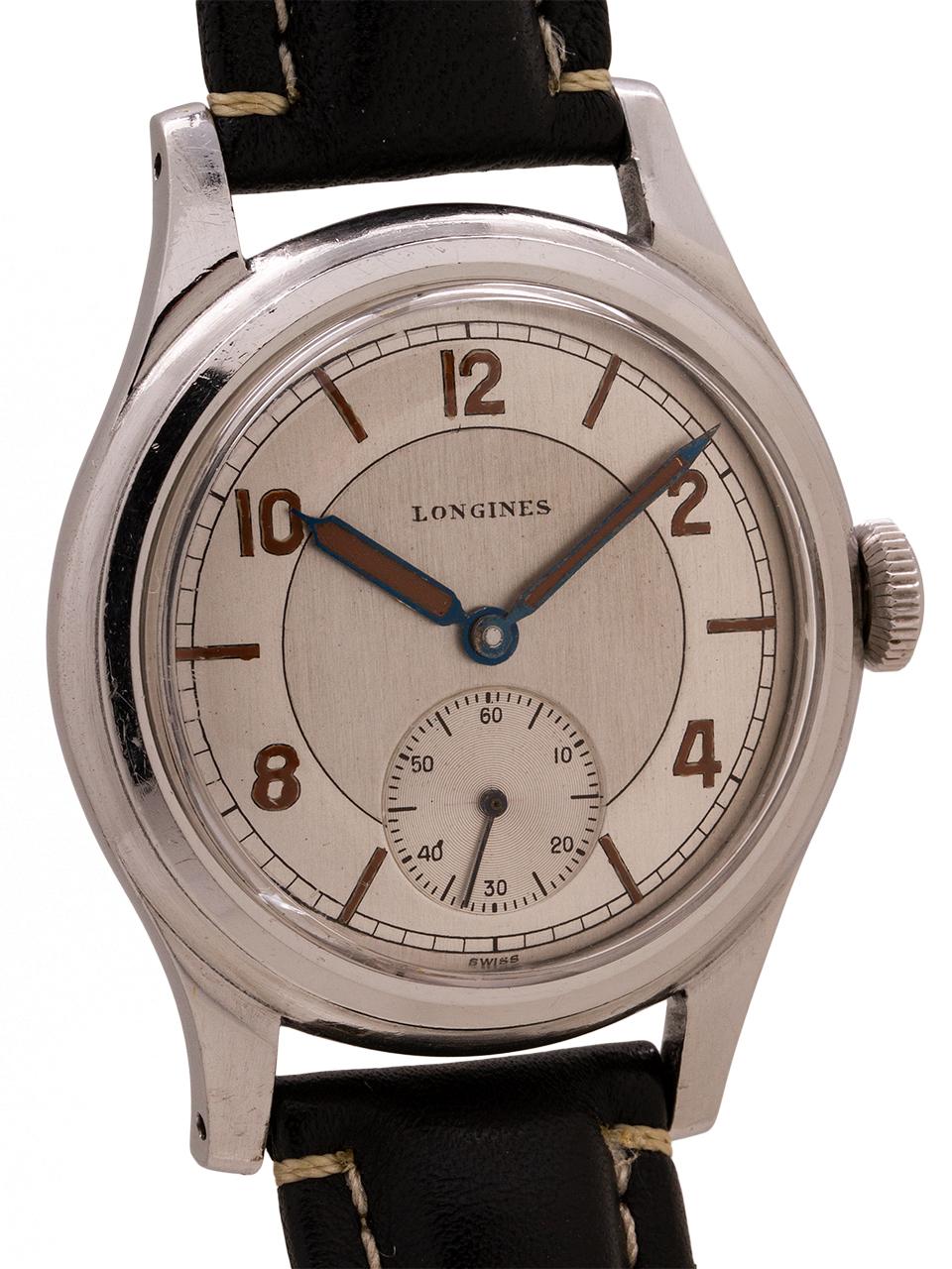 
Vintage man’s Longines stainless steel oversize manual wind dress model circa 1940’s. With a beautiful, professionally restored silver sector dial. With blued steel syringe style hands filled with dark brown luminous material, with matching hour