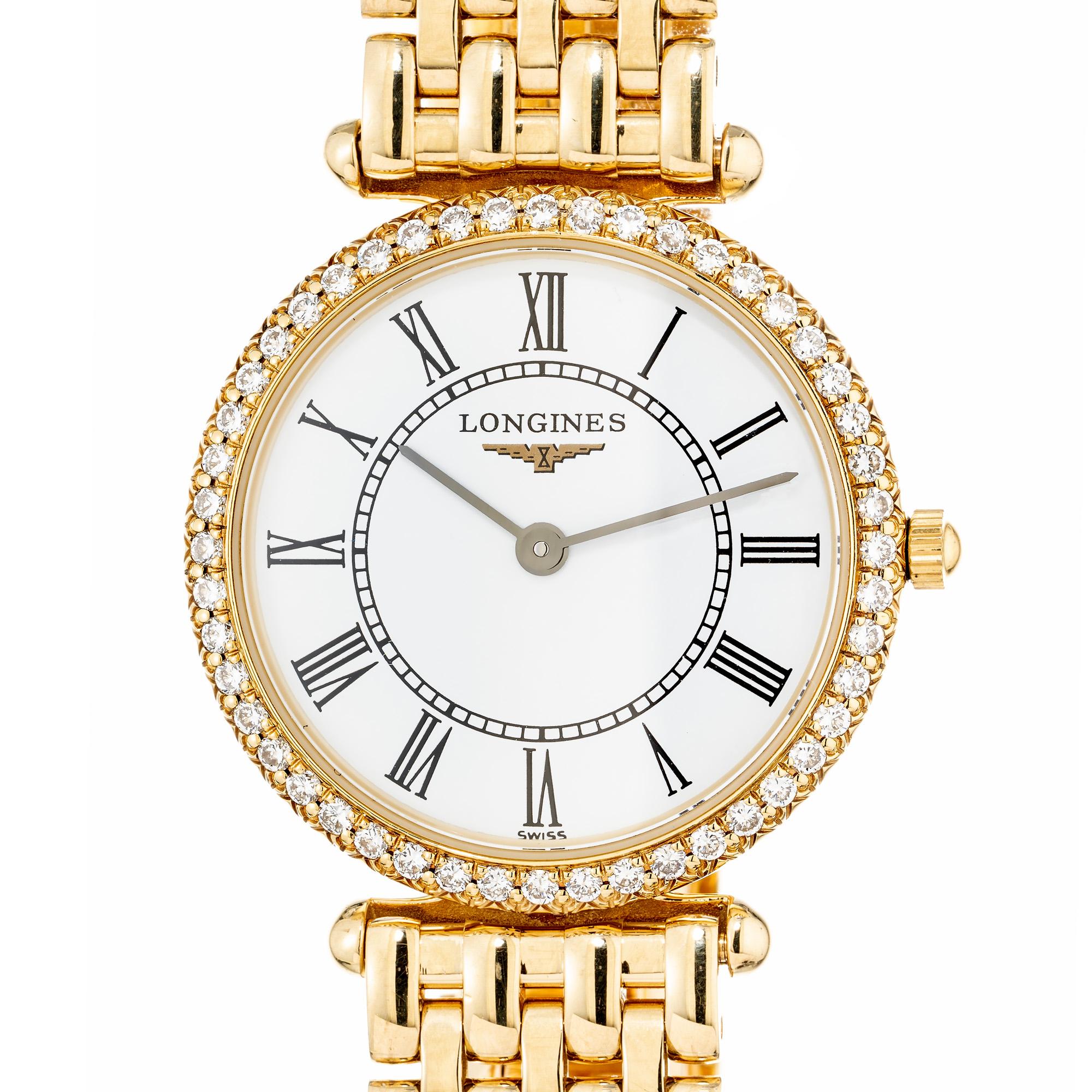 Ladies solid 18k gold Longines Quartz watch. White Roman Numeral dial with a diamond bezel of 40 round cut diamonds totaling .30cts. The panther bracelet length is 7.25 with 5 removable links. 

48 round cut diamonds, approx. total weight:
