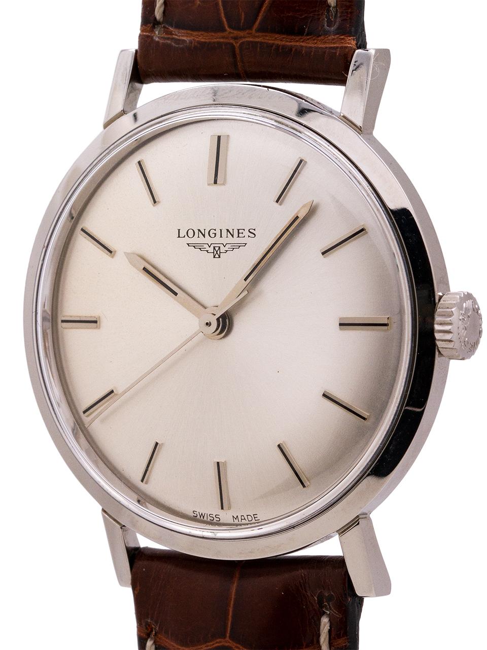 
Very minty condition vintage Longines dress model circa 1960’s. Featuring unpolished 35mm diameter case with snap down back, stepped bezel, and straight extended lugs. With minty condition original silver satin dial with applied silver indexes and