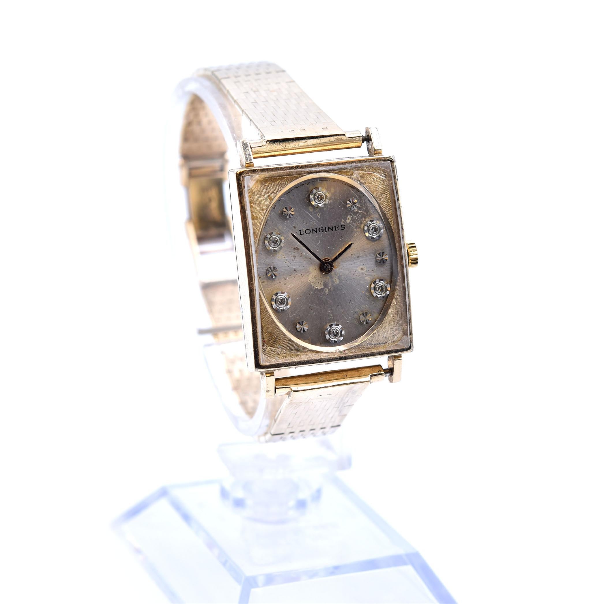 Movement: quartz
Function: hours, minutes
Case: 28.38mm by 23.88mm rectangle 10k yellow gold-filled case, plastic crystal, pull/push crown
Dial: silver dial with diamond hour markers, silver hands
Band: 14k yellow gold bracelet with double fold down