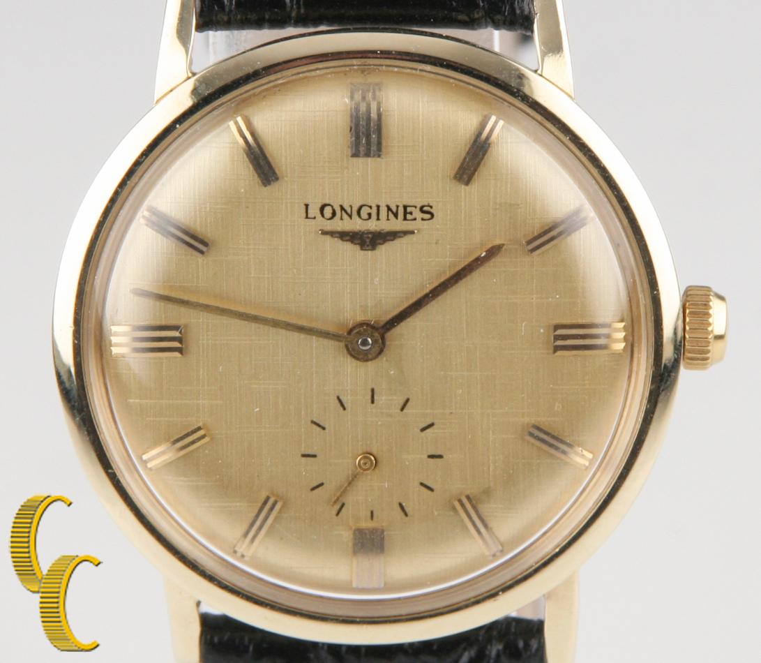 Vintage Longines Classic 14k Gold Men's Wrist Watch Leather Hand Wind Working
Model: Classic Round
Case #5944714-2719
Movement #370

14k Yellow Gold Case w/ Roman Numerals
Includes mechanical hand-wound movement
Hallmarks: 
