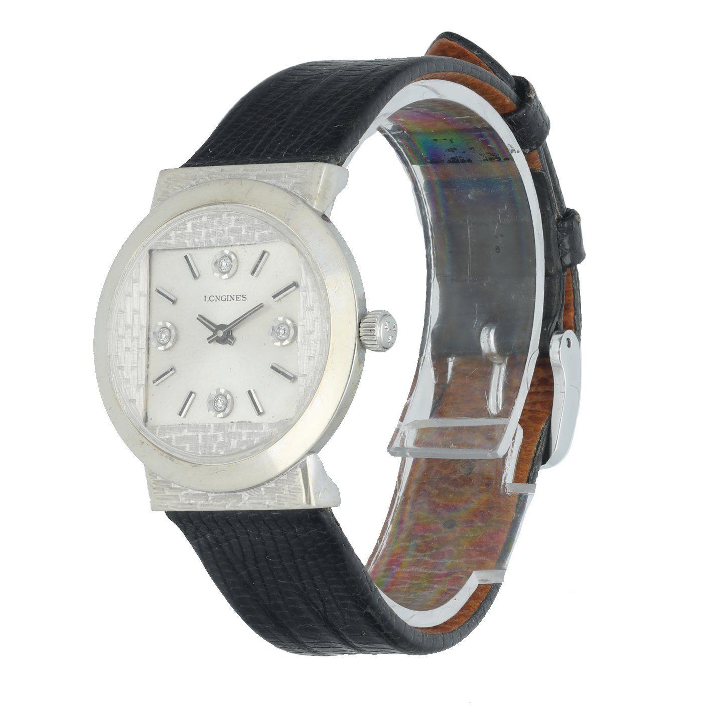 Â Longines vintage ladies watch. 30MM 14K white gold round case with square dial. Silver dial withÂ diamond hour markers at the 3, 6, 9, & 12 oâ€™clock positions. Black leather adjustable strap with buckle; will fit up to 7-inch wrist. Acrylic