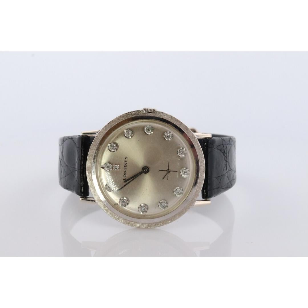 Vintage By aus den 1950er Jahren
Band MATERIAL: Leder, Edelstahl
MATERIALIEN: Gold, Weißgold
Leistung: Mechanisch

Ablesung: Analog

LONGINES UHR. 14k Longines Diamond Herrenuhr mit 13 Diamanten Zifferblatt. 1950er-1960er Jahre manuelle