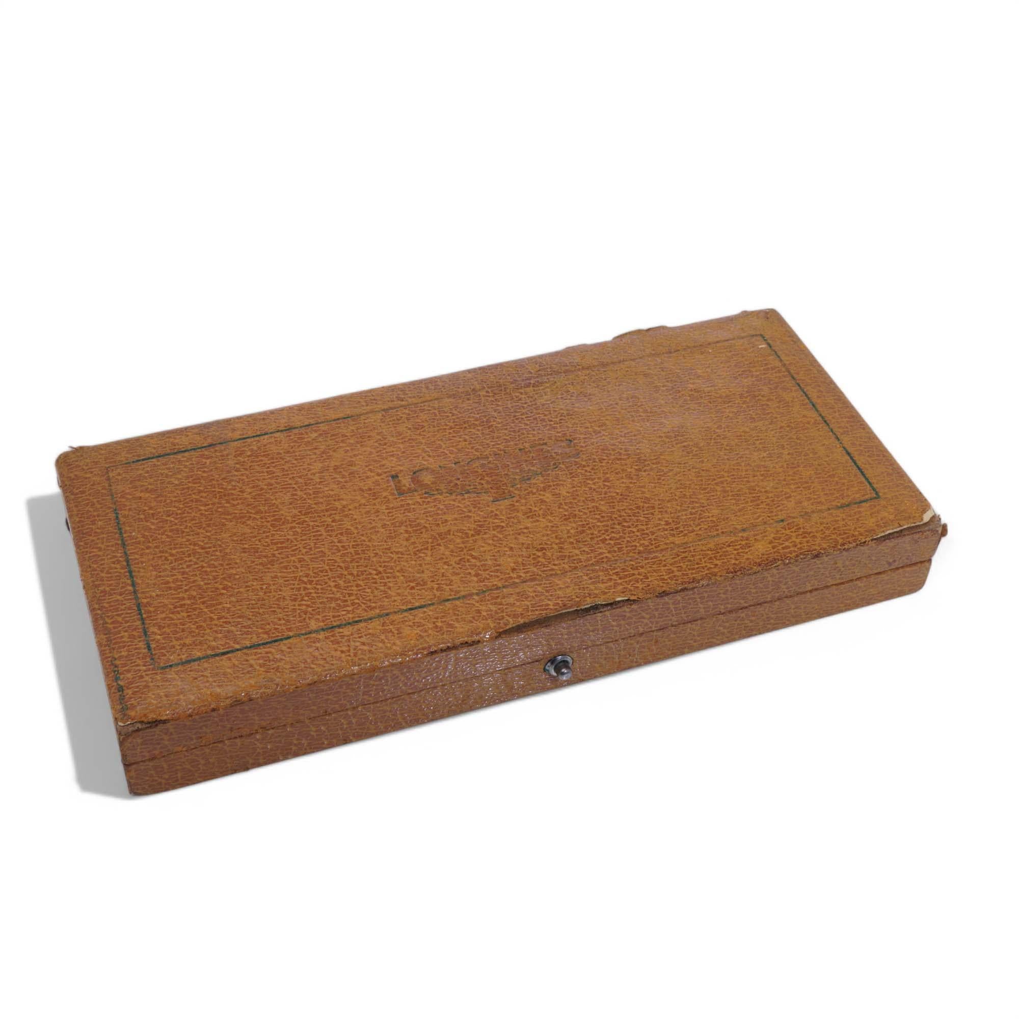 Longines Watch Box. 

Period: Mid to late 20th century
Material: Black leather exterior with cream satin and deep red velvet interior
Purpose: Designed for storing and presenting watches, bracelets, or necklaces
Dimensions: 22.2 x 4.5 x 2.7