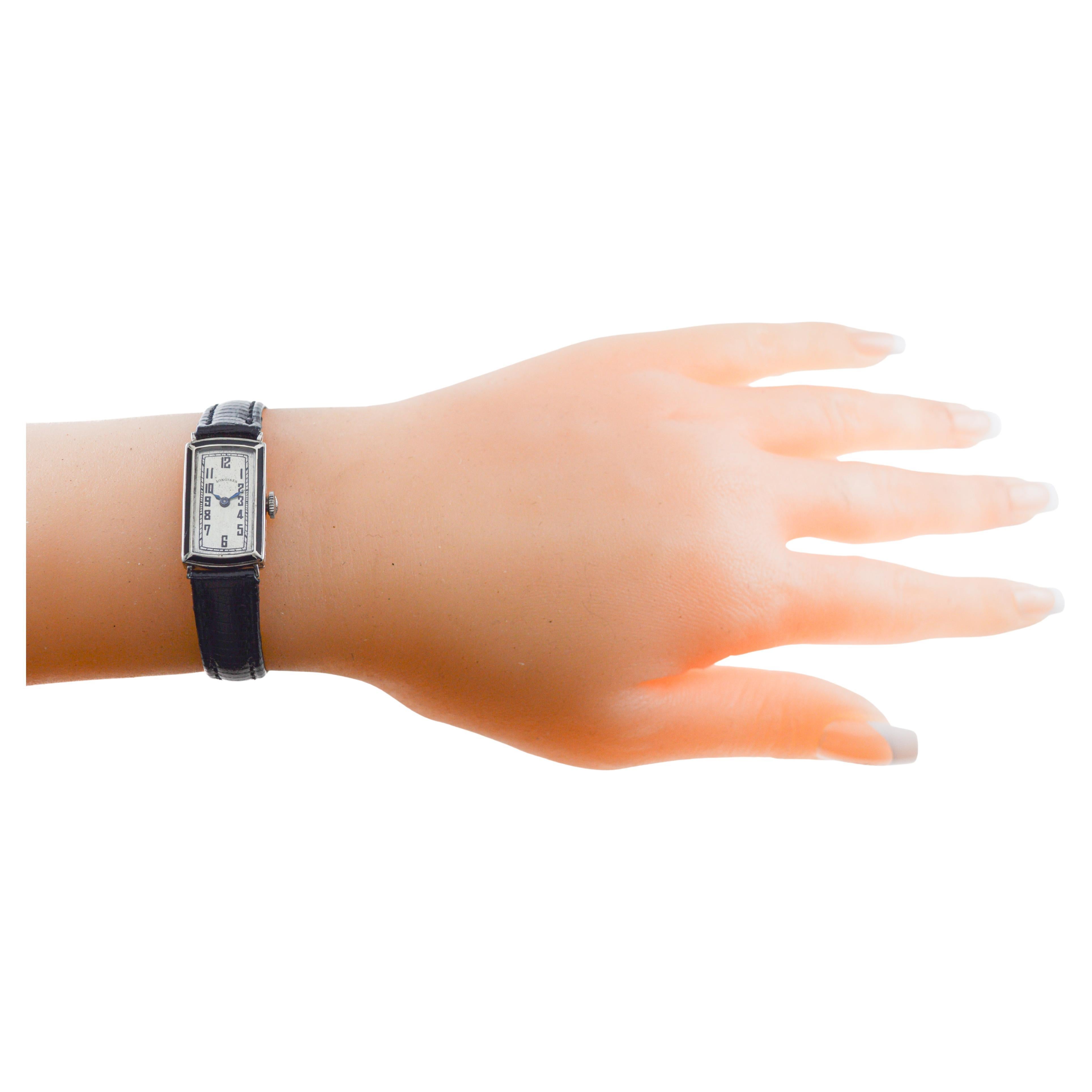 FACTORY / HOUSE: Longines Watch Company
STYLE / REFERENCE: Art Deco with Enamel Inlay / Tank Style 
METAL / MATERIAL: White Gold Filled
CIRCA / YEAR: 1928
DIMENSIONS / SIZE: Length 28mm X Width 14mm
MOVEMENT / CALIBER: Manual Winding / 17 Jewels /