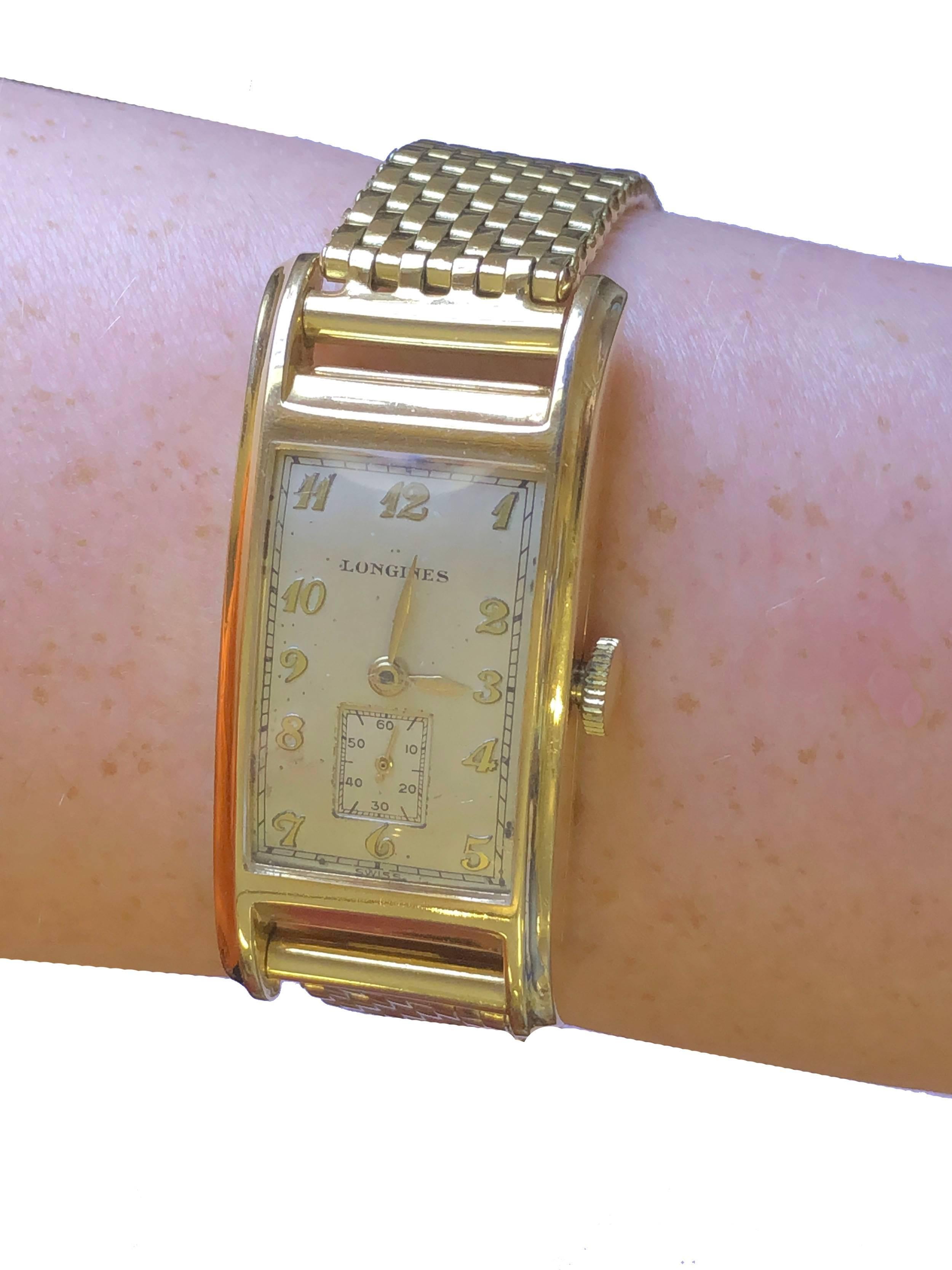 Longines, Gelbgold-Armbanduhr im Art déco-Stil, 1943 (Geformt)