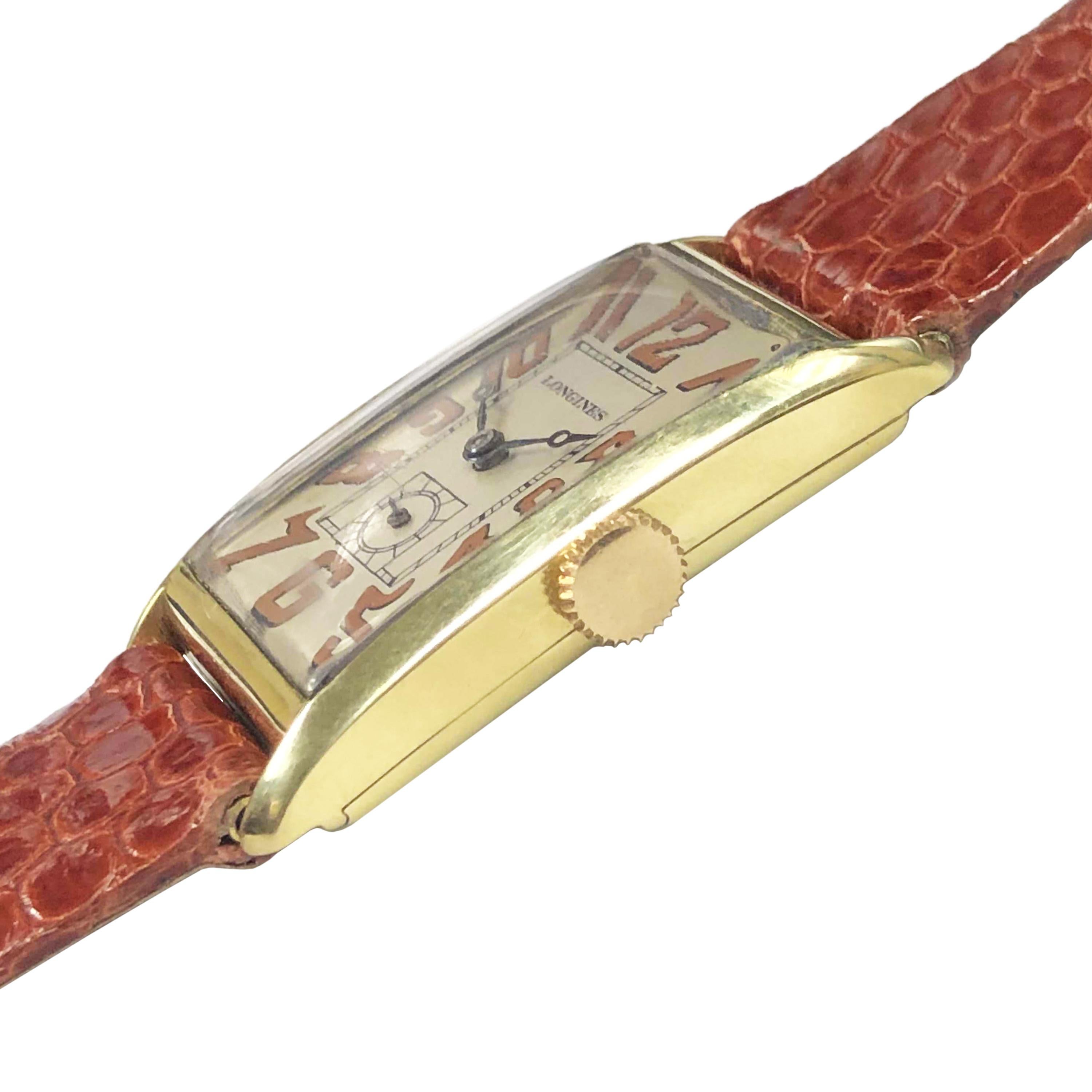 Circa 1930 Longines Art Deco Wrist Watch, 39 X 22 MM 14K Yellow Gold Elongated case. 17 Jewel Nickle lever movement, silvered satin dial with exaggerated Luminous filled Arabic numbers and a sub seconds hand. New Brown Snake strap, recently servied