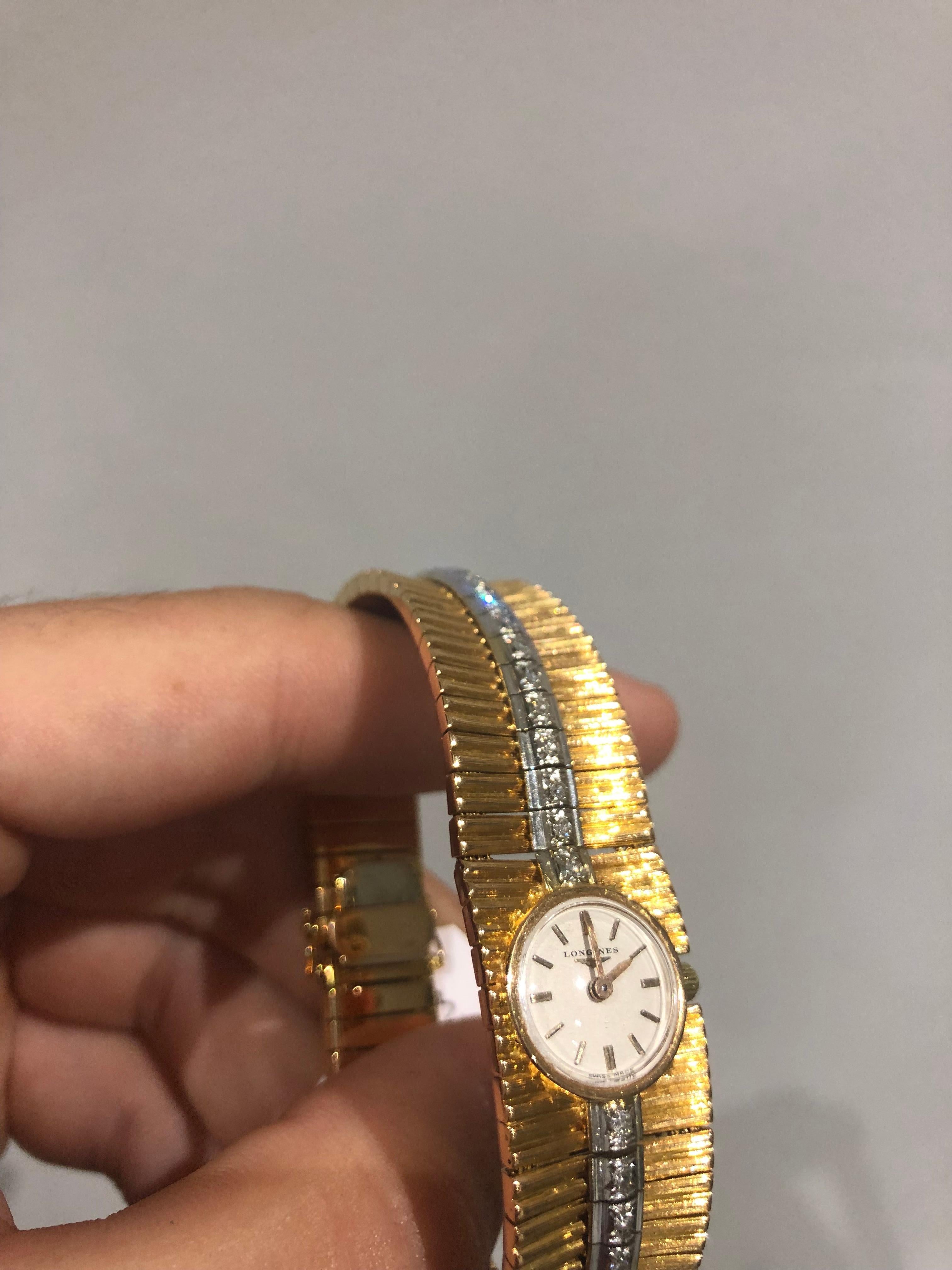 An 18k Yellow Gold Diamond Set Vintage Ladies Cocktail Wristwatch, silver dial with applied index batons, an 18k yellow gold patterned integrated bracelet set with approximately 22 diamonds in white gold with an 18k yellow gold jewellery style