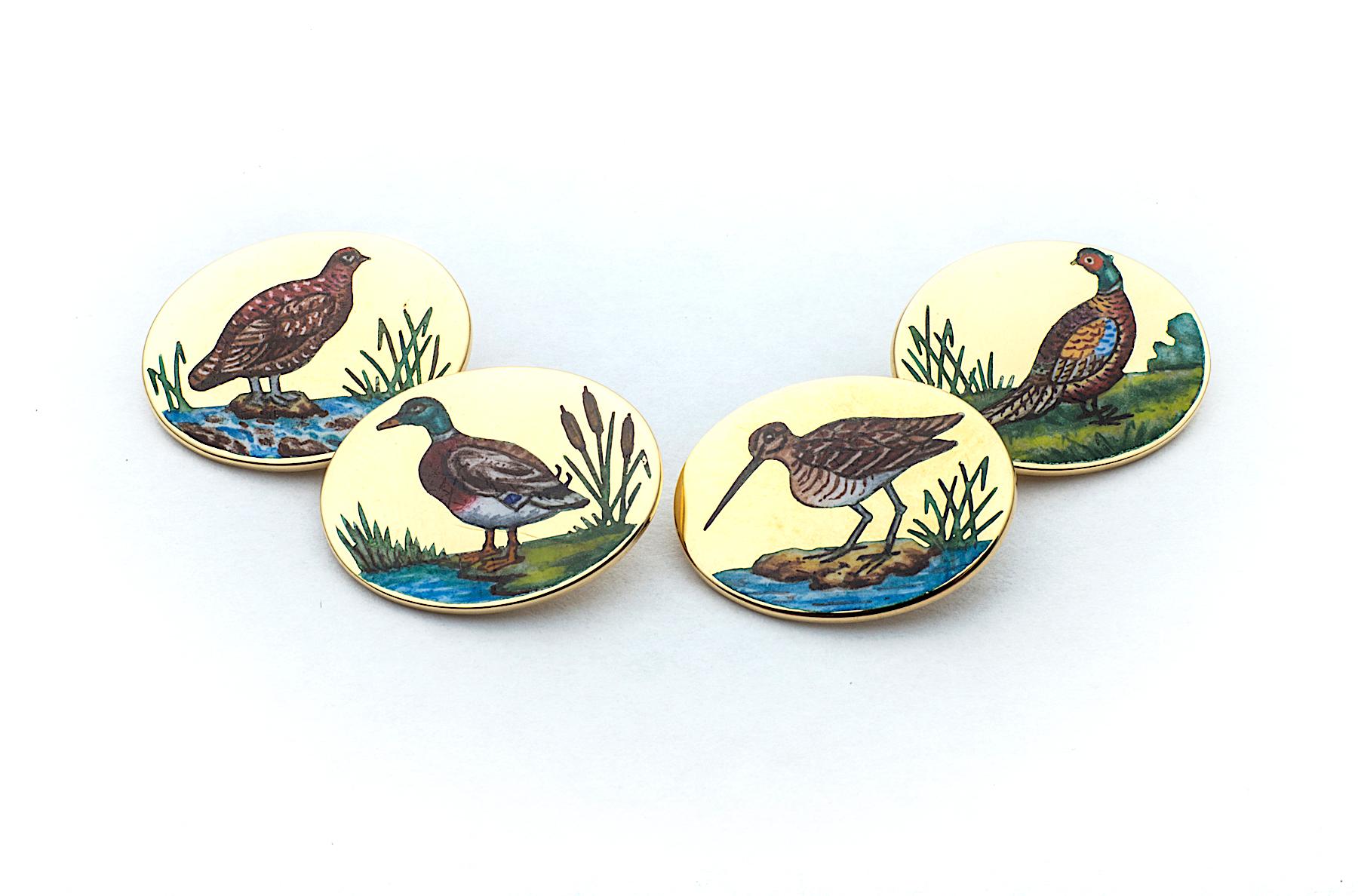 Let the games begin with these vintage Longmire 18 karat yellow gold enamel gamebird cufflinks that are guaranteed to always give you the winning edge.  Hand enameled by old world craftsmen, these one-of-a-kind oval chain link cufflinks feature four