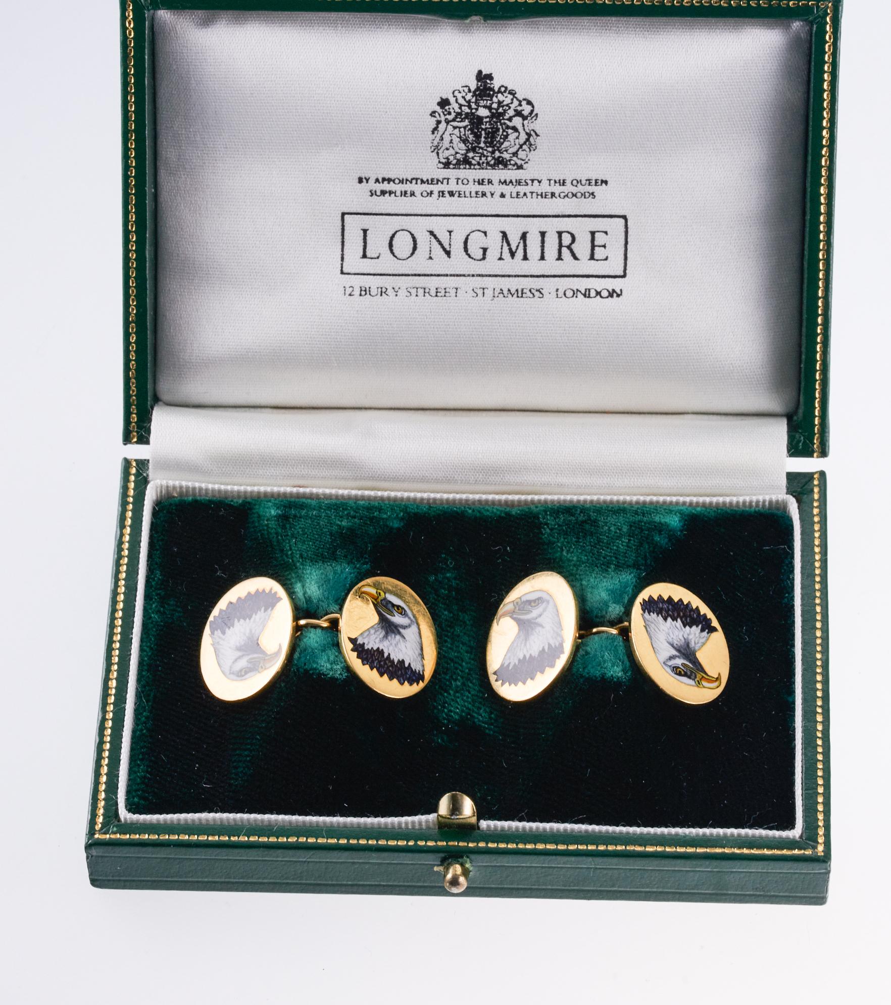 Pair of 18k gold oval cufflinks, crafted by Longmire of London, featuring enamel eagle chest on each. Top measures 19mm x 15mm. Set comes in original fitted box. Marked Longmire, PL, English marks. Weight of the pair - 15.6 grams. 