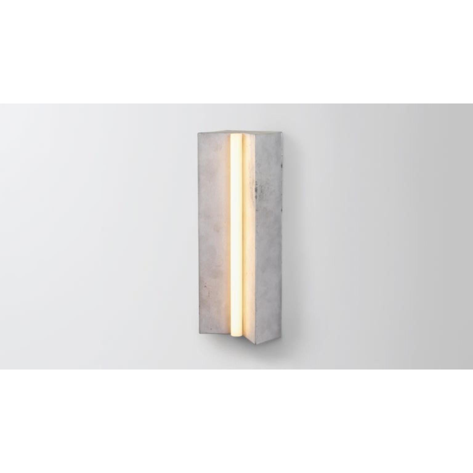 Longton in Aluminum by Volker Haug
Anton series
Dimensions: W 18 x H 51 x D 10 cm.
Materials: Cast Aluminum
Finish: Raw (Aluminium) 
Lamp: S14s LED, Opal (240V / 120V US)
Weight: 4kg 

Longton is cast as raw aluminium or polished gunmetal.
Form