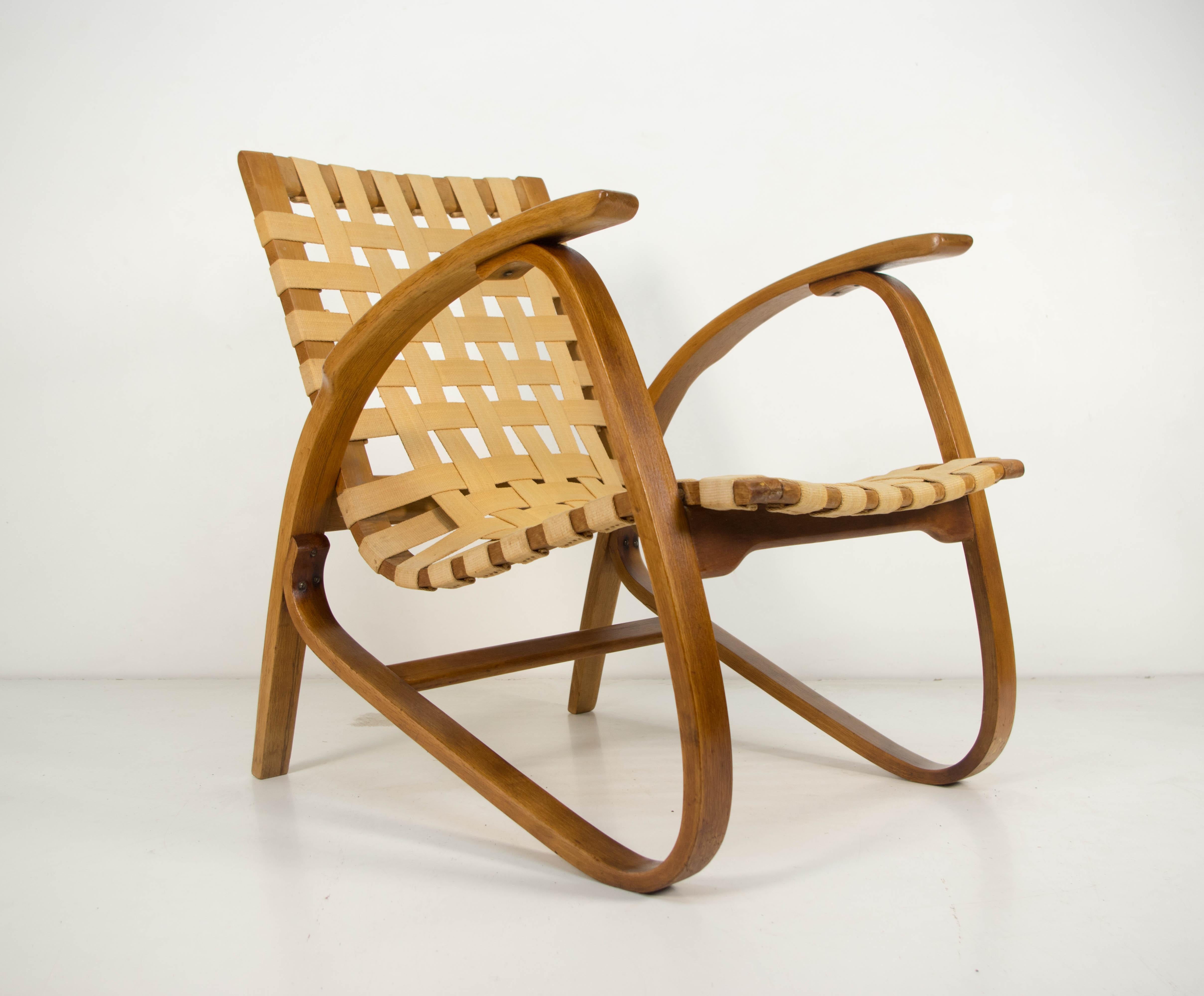 Iconic beech bentwood armchair by Jan Vanek. 
Original wool straps
Armrests were partly refinished.