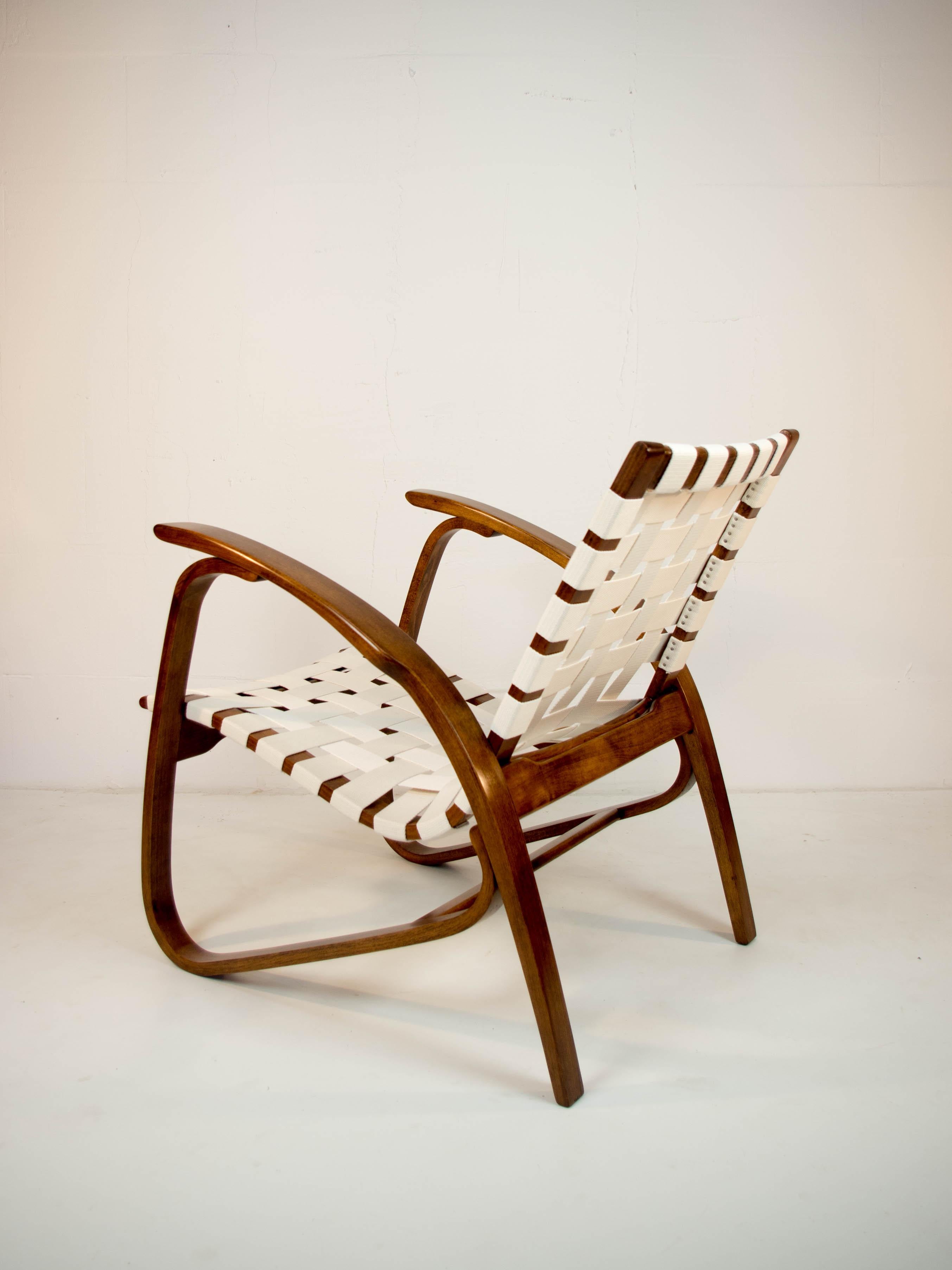 Iconic beech bentwood armchair by Jan Vanek. Very comfortable and eye-catching piece! Proffesionally restored: wood refurbished, new straps. 7 items available. Colour of the wood on demand. Production time 2-3 weeks.