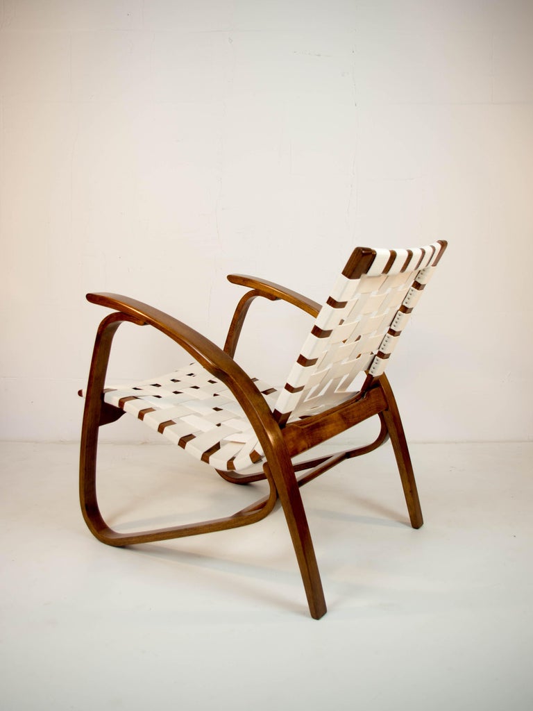 Iconic beech bentwood armchair by Jan Vanek. Very comfortable and eye-catching piece! Professionally restored: wood refurbished, new straps. 7 items available. 
