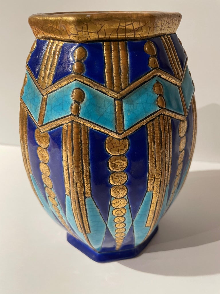 An Art Deco “Ceramic Cloisonne” vase by Longwy from the early 1930s. This is an exceptional example from the Longwy pottery works with its lavish use of gilded enamel, and its unusual octagon shape along with the classic use of contrasting blues-