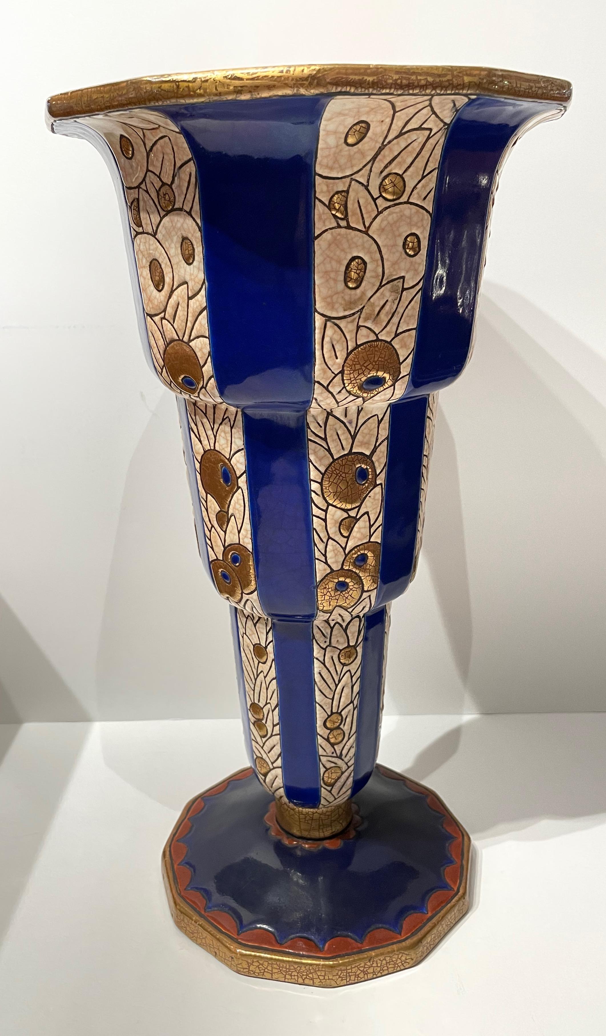 Longwy Art Deco French Cloisonné ceramic vase. Stunning extra large size, bright color with faceted base. Stepped design treatment of blue and gold with repeated flower pattern design intersected in blue triangular lines. This design intersects