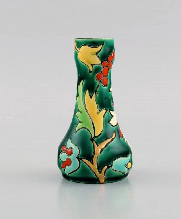 Longwy, France. Art Deco vase in glazed stoneware with hand-painted flowers on a green background. 
1920s / 30s.
Measures: 10 x 5.5 cm.
In excellent condition.
Stamped.

The French town of Longwy, in the region of Lorraine near the Belgian