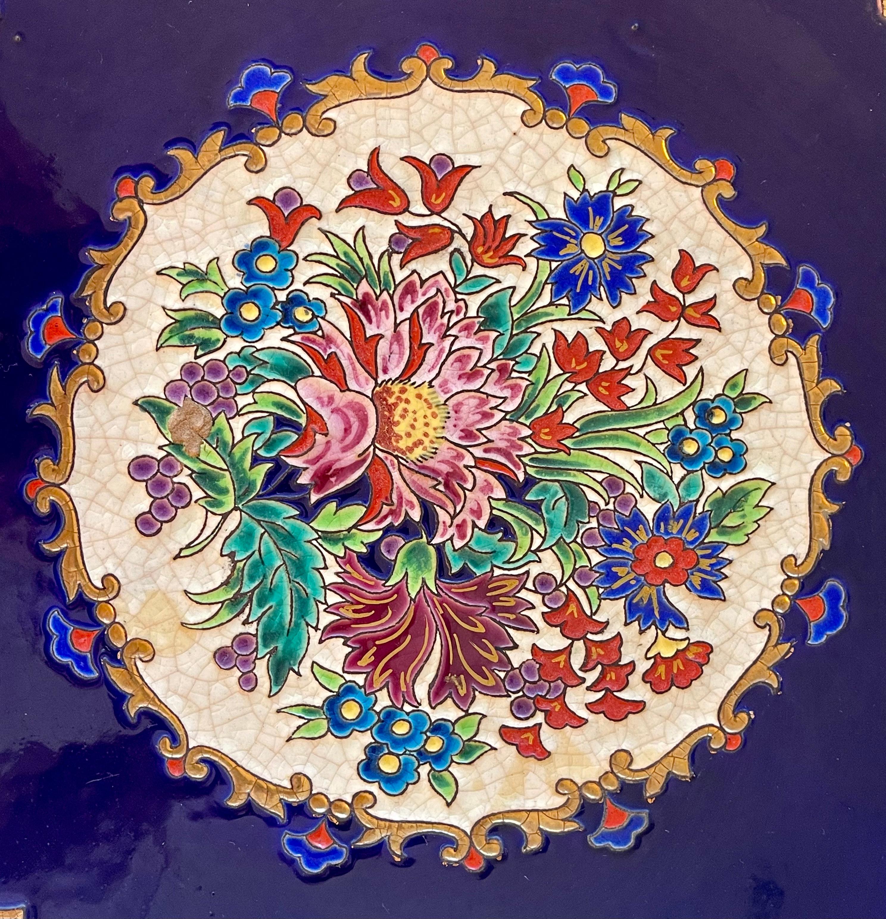Large Renaissance model dish or plate with floral decoration on a royal blue background signed on the reverse 