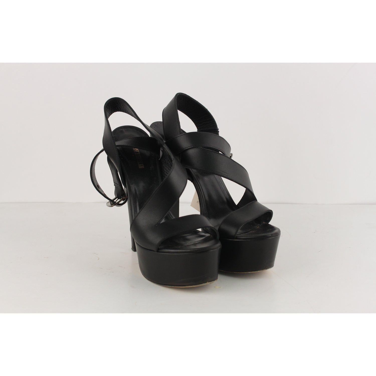 MATERIAL: Leather COLOR: Black MODEL: Platform Heels GENDER: Women SIZE: 38 COUNTRY OF MANUFACTURE: Italy Condition CONDITION DETAILS: B :GOOD CONDITION - Some light wear of use - some wear of use on the insoles, some wear of use on the outsoles -