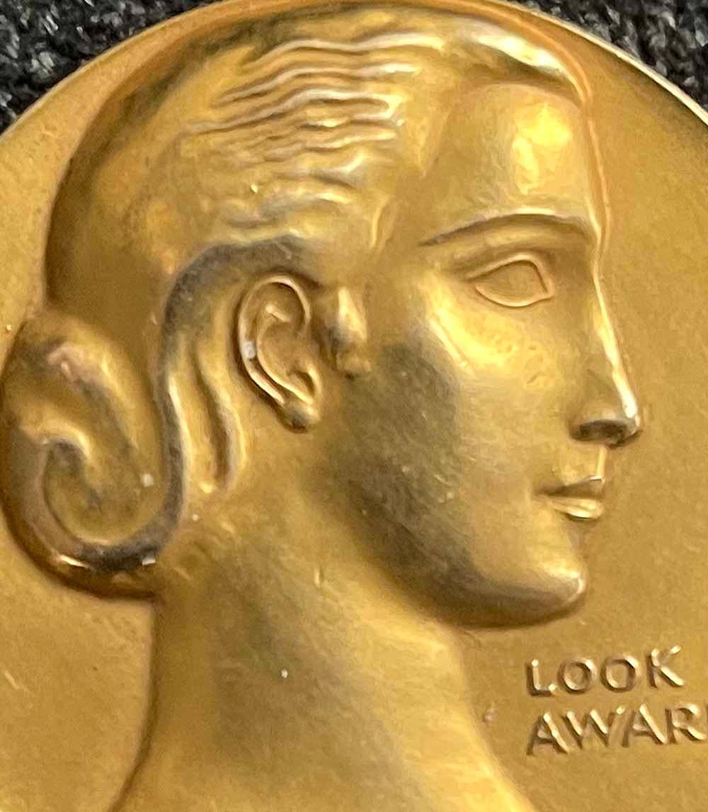 Important both artistically and historically, this unique gold medallion for Film Achievement was commissioned by Look magazine, sculpted by William Zorach, struck by the the renowned Medallic Art Company, and given to William Goetz in 1952.  Goetz
