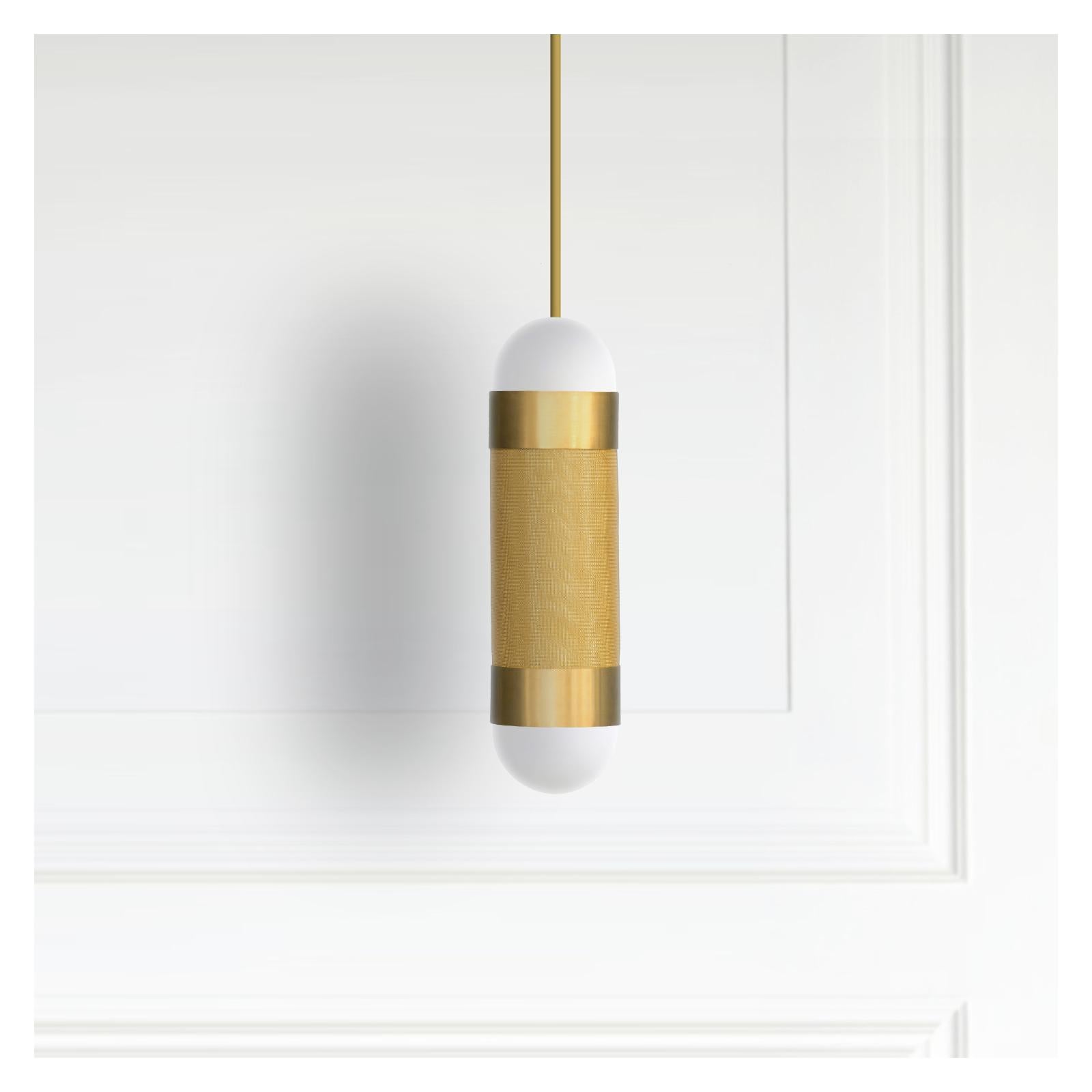 The LOOM pendant light is defined by its signature woven brass cylinder topped with hand-brushed brass sleeves and completed with soft-white borosilicate glass domes. When illuminated the LOOM emanates a soft, warm glow through the brass weave,