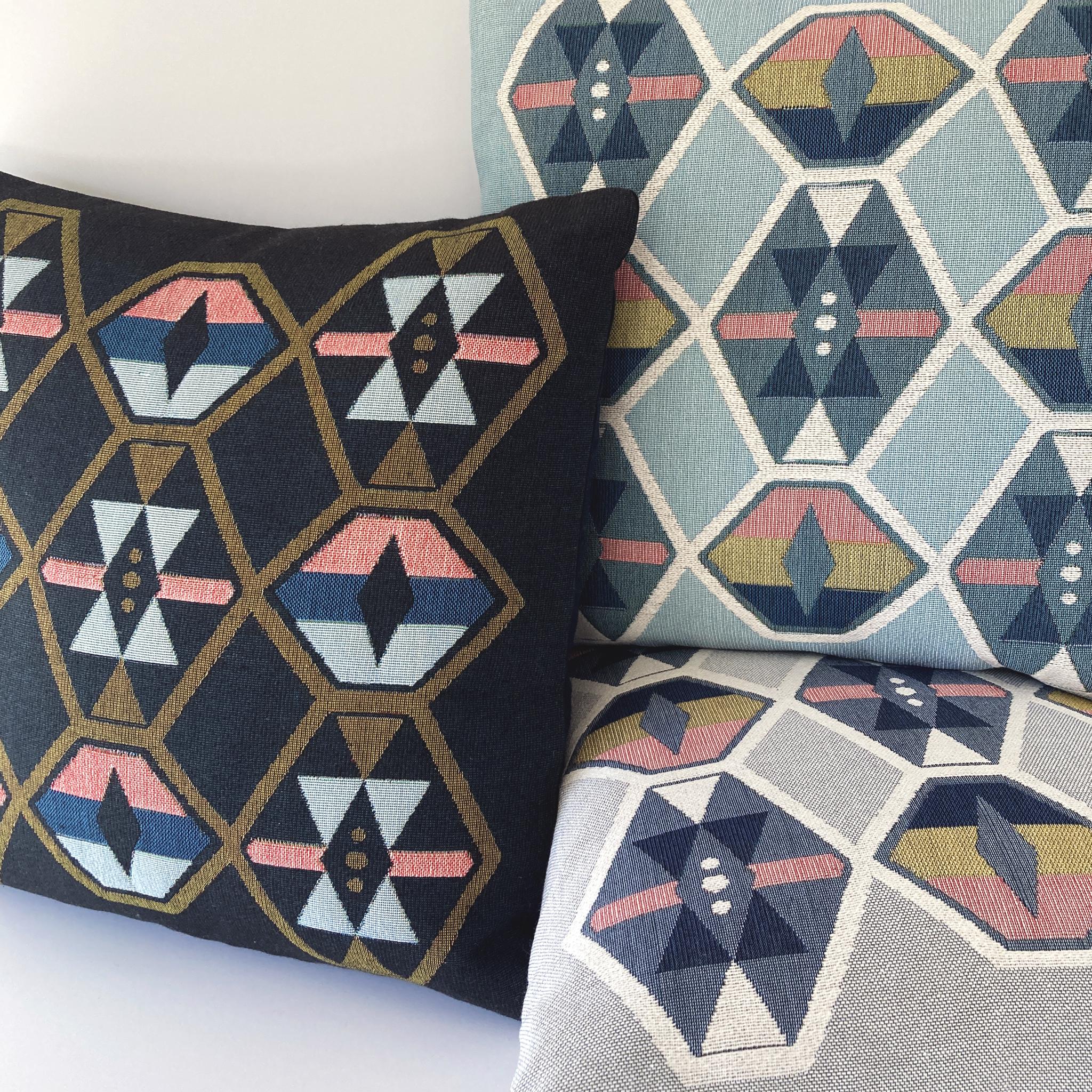 Twilight Navy geometric upholstered pillow with navy linen backing, down pillow insert made locally in NYC. Cotton upholstered fabric woven on a jacquard loom, made in the US. Pillow measures 17 x 17 inches.

The geometric patterned pillow is