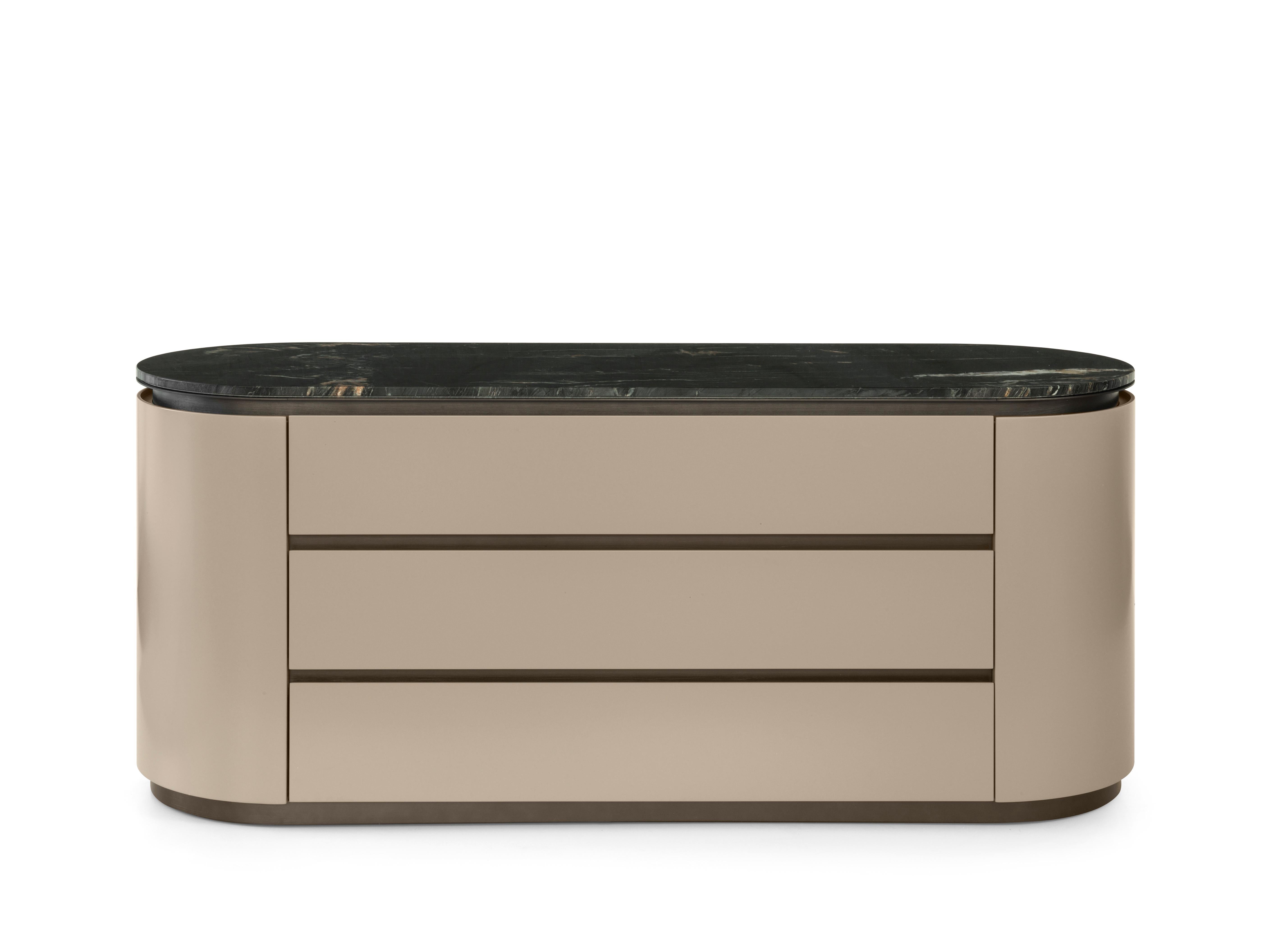 Loop Chest of Drawers by Redeco
Dimensions: W 160 x D 52 x H 70 cm
Materials: Curved plywood and mdf structure. Top with metal frame available with marble or lacquered mdf. Three soft closing drawers. Warm Grey N.56 lacquered matt finishing, top in