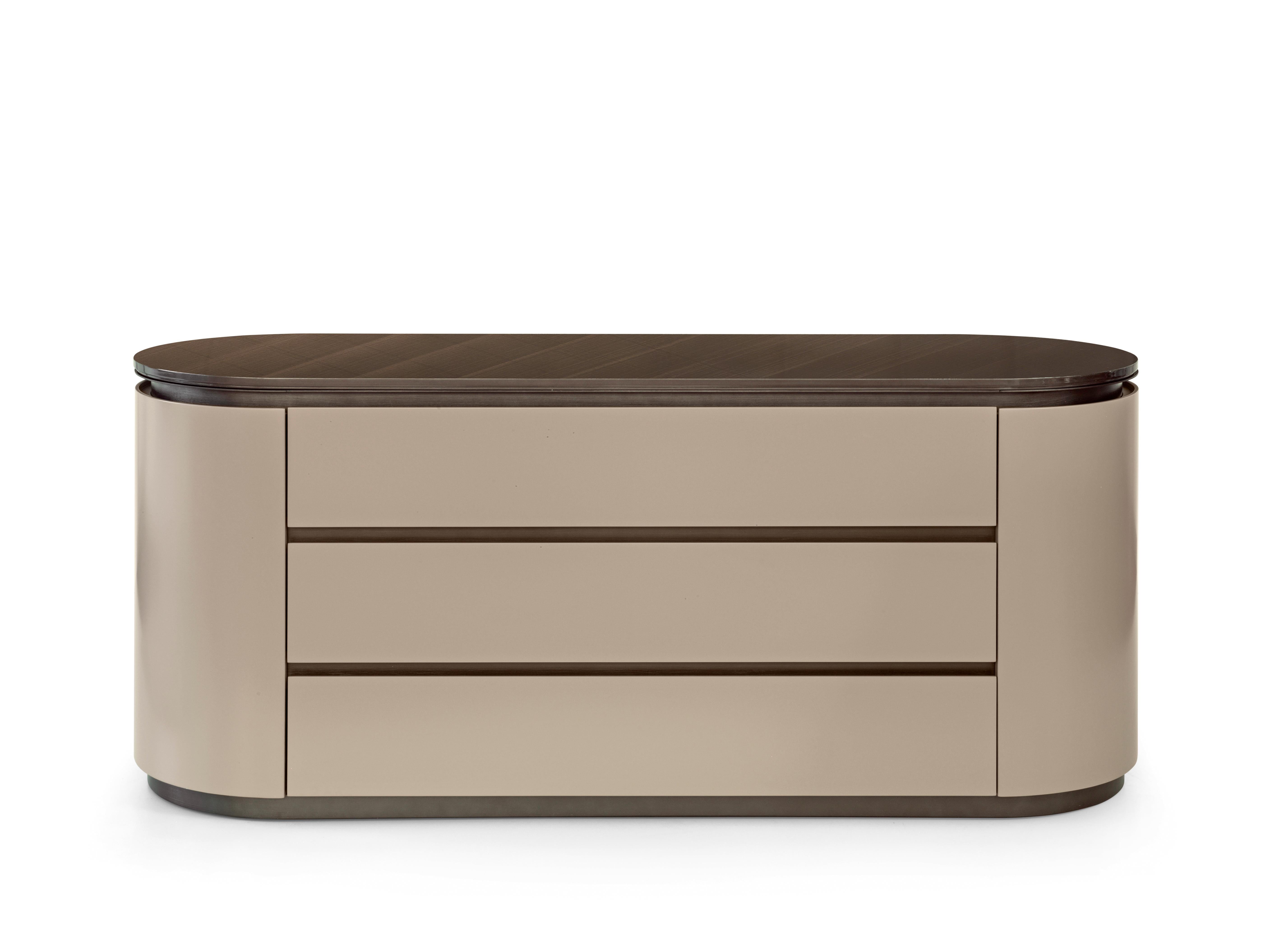 Loop 5057 Chest of Drawers by Redeco
Dimensions: W 160 x D 52 x H 70 cm
Materials: Curved plywood and mdf structure. Top with metal frame available with marble or lacquered mdf. Three soft closing drawers. Warm Grey N.56 lacquered matt finishing,