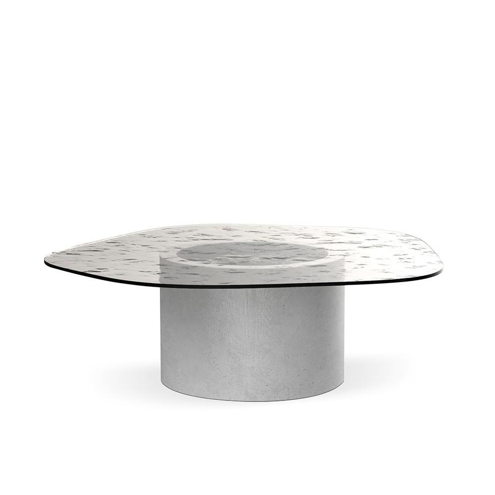 Loop center table by Collector
Dimensions: W 93 x D 92 x H 40 cm
Materials: glass, travertino
Other materials available.

The Collector brand aims to be part of the daily life by fusing furniture to our home routine and lifestyle, that’s why