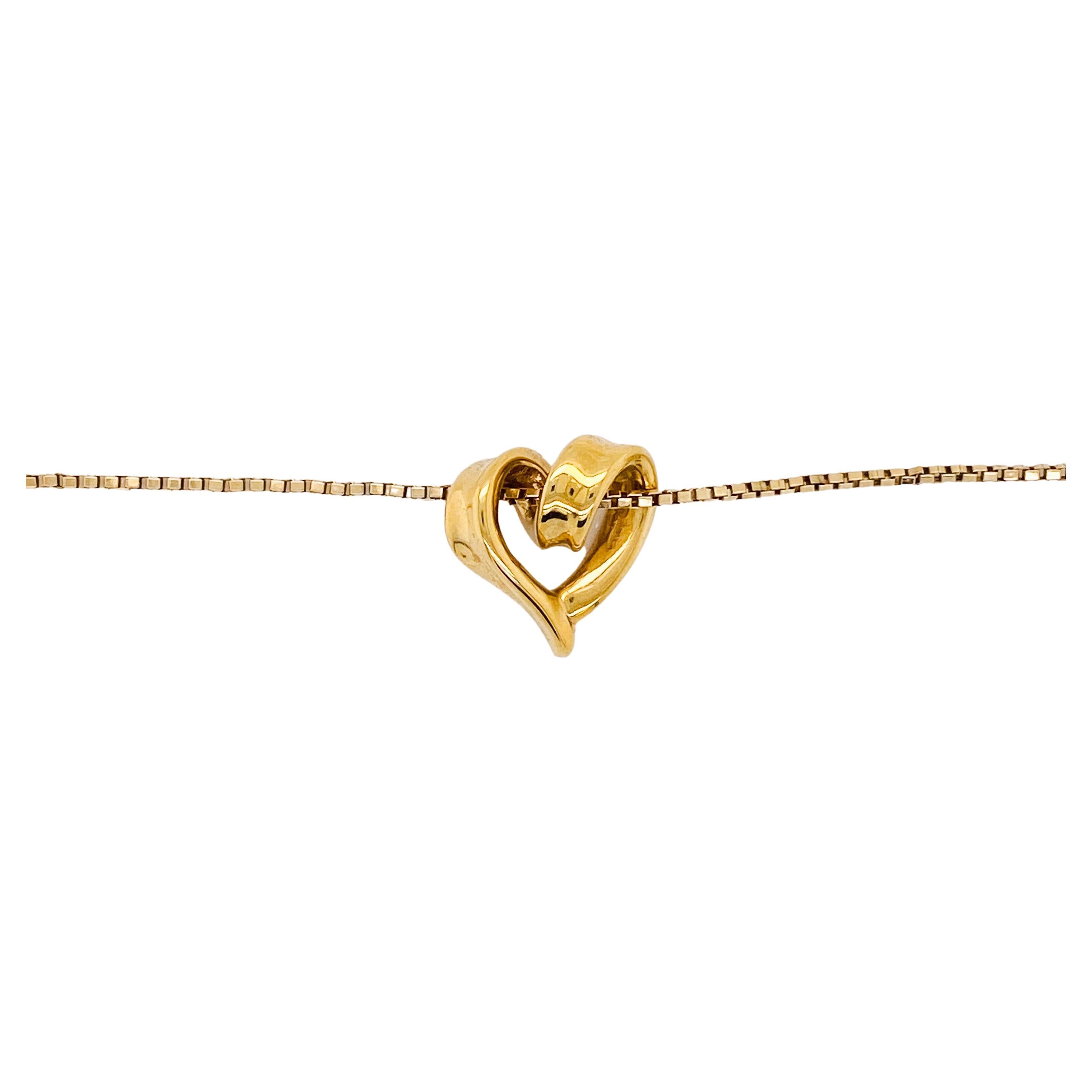 My Heart Belongs to You. Whimsical and well-made, this heart tells a story to all that wear it. The free-form ribbon style heart loops around just like your heart soaring with love. The bright box chain slides through the heart loops to keep your