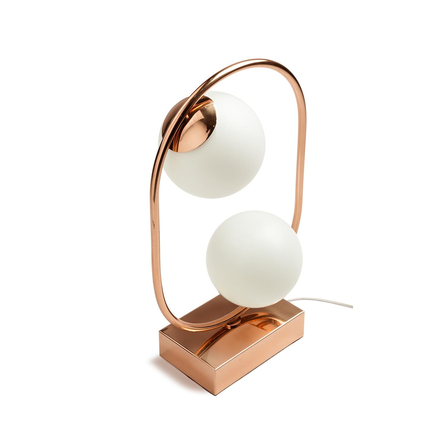 Loop table lamp evokes a sense of playfulness thanks to the juxtaposition of primary shapes. It can be used to create a modern yet timeless space and resembles a modern, elegant sculpture, producing a magical luminous atmosphere. Made to Order.